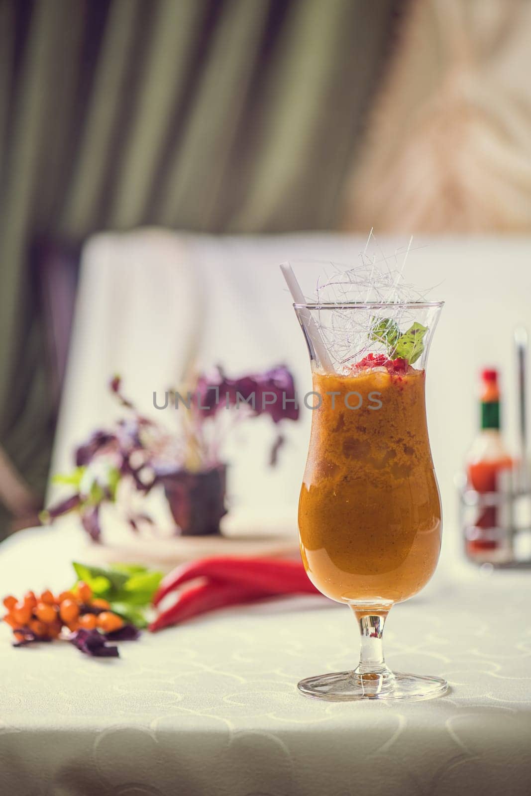 Cocktail from sea buckthorn fresh berries on the table