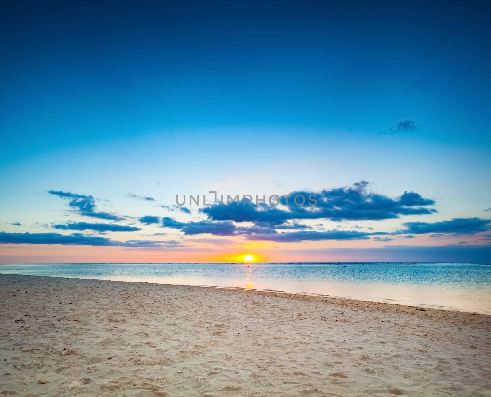 Beautiful landscape. White sandy beach at sunset. Mauritius.