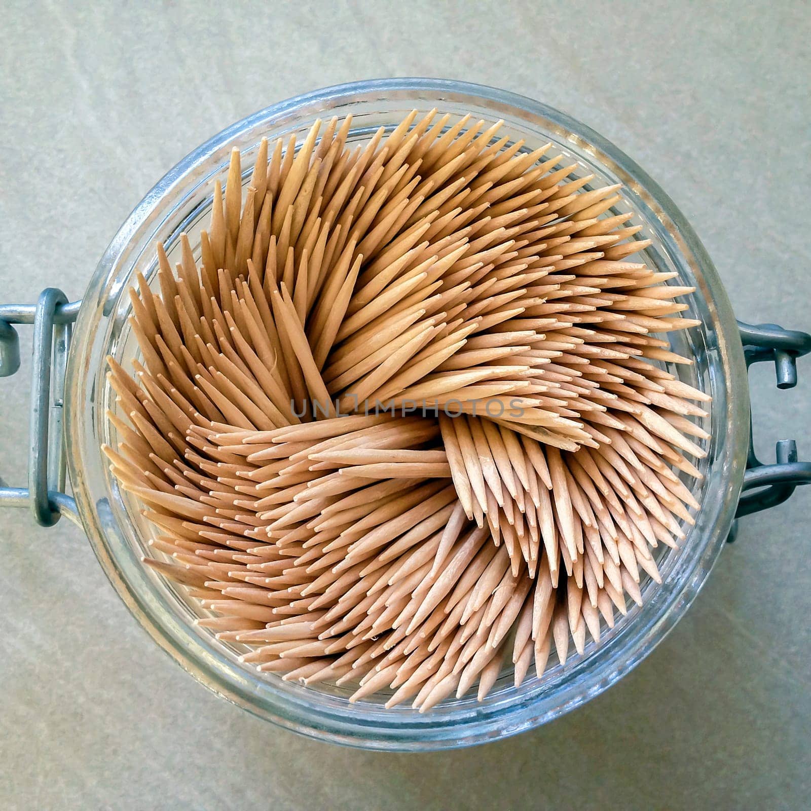 aerial view of a group of toothpicks in a glass jar