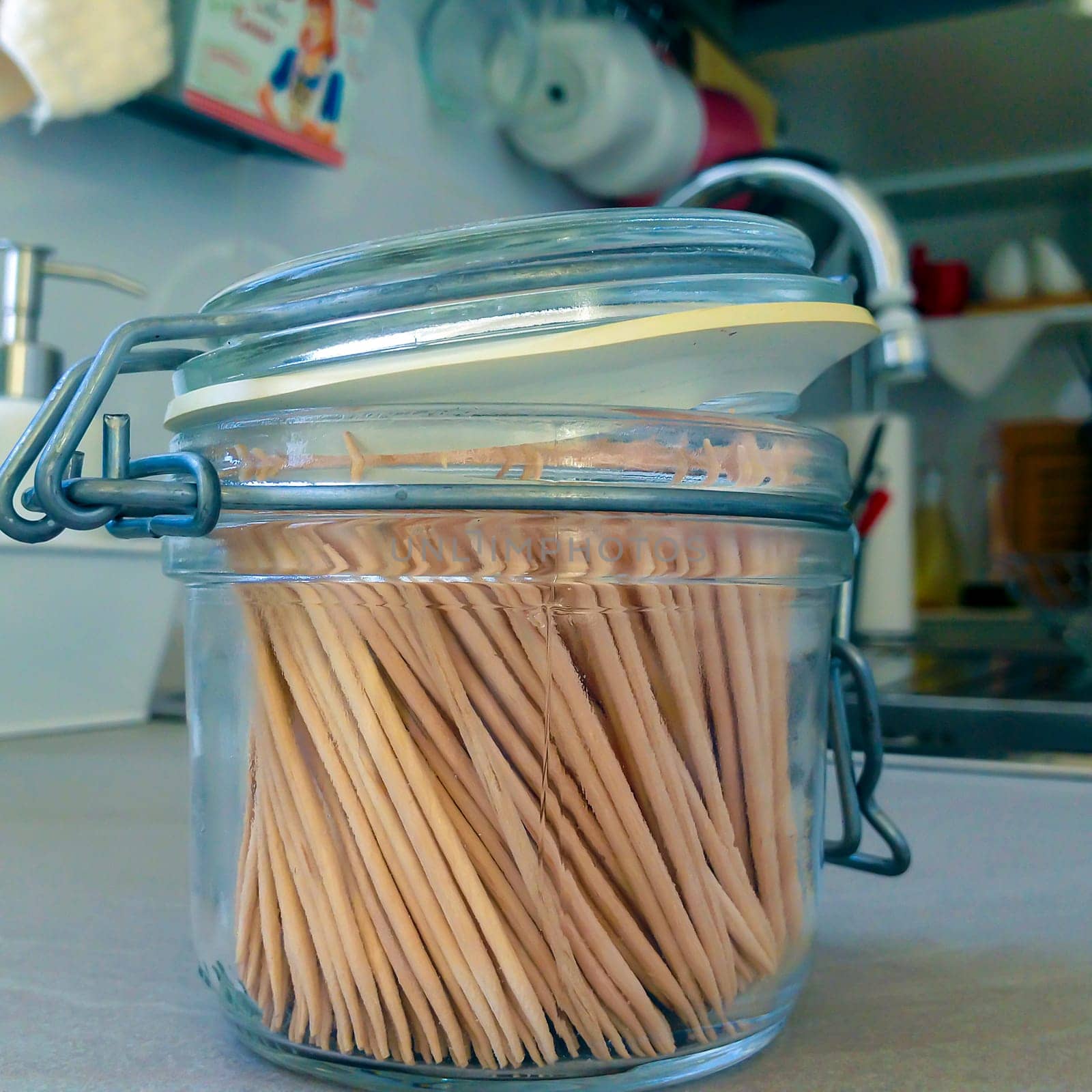close up of toothpicks in a glass jar