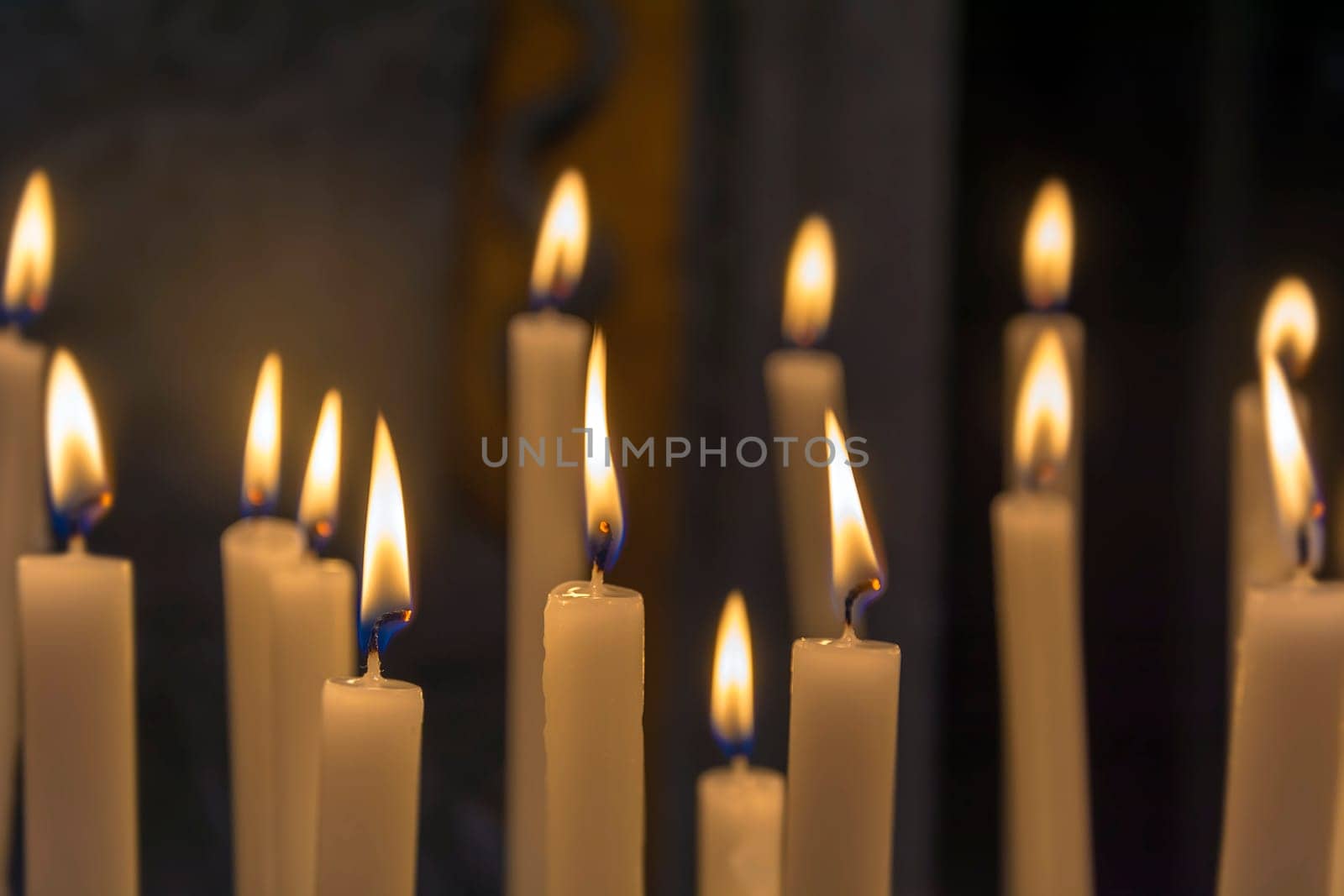 group of candles with a dark background