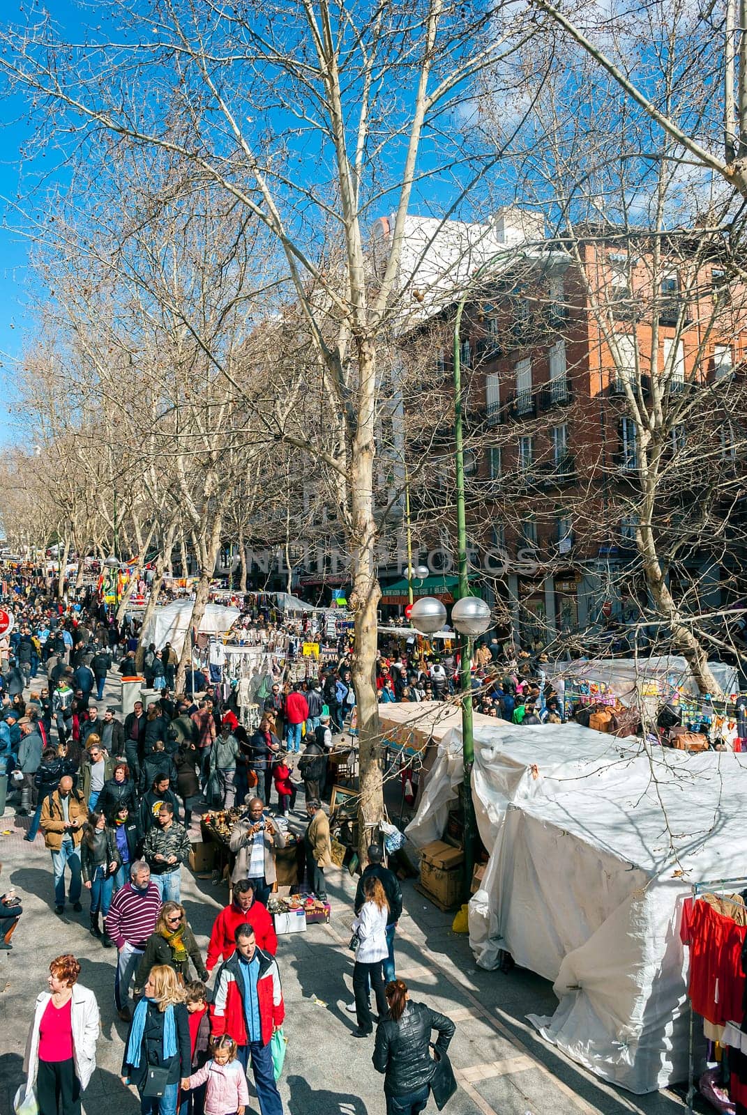 Madrid, Spain, february 28, 2010: Scene from El Rastro flea market in Madrid, Spain. El Rastro is held in La Latina neighborhood every Sunday and it’s the most important market in Madrid.