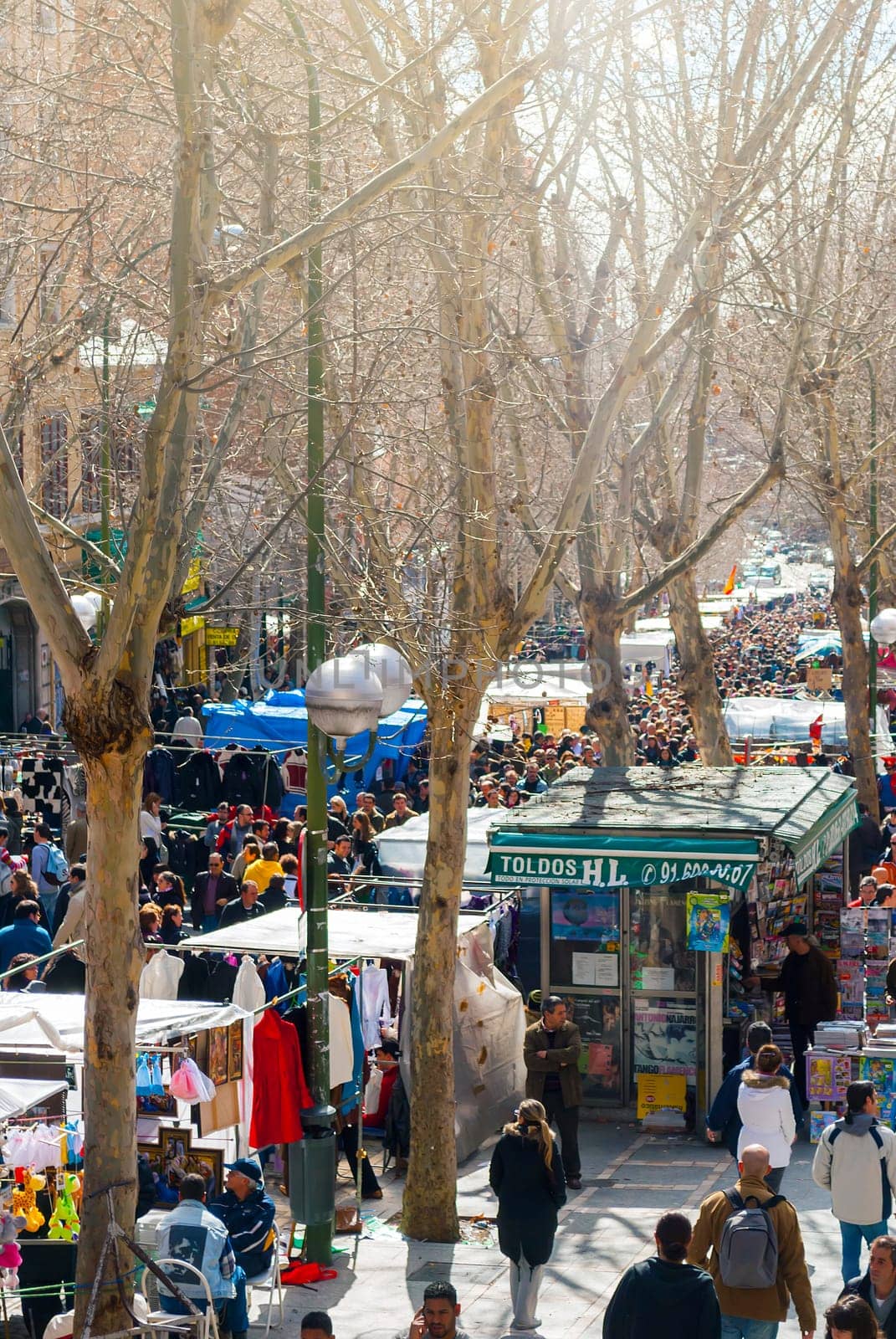 Madrid, Spain, february 28, 2010: Scene from El Rastro flea market in Madrid, Spain. El Rastro is held in La Latina neighborhood every Sunday and it’s the most important market in Madrid.