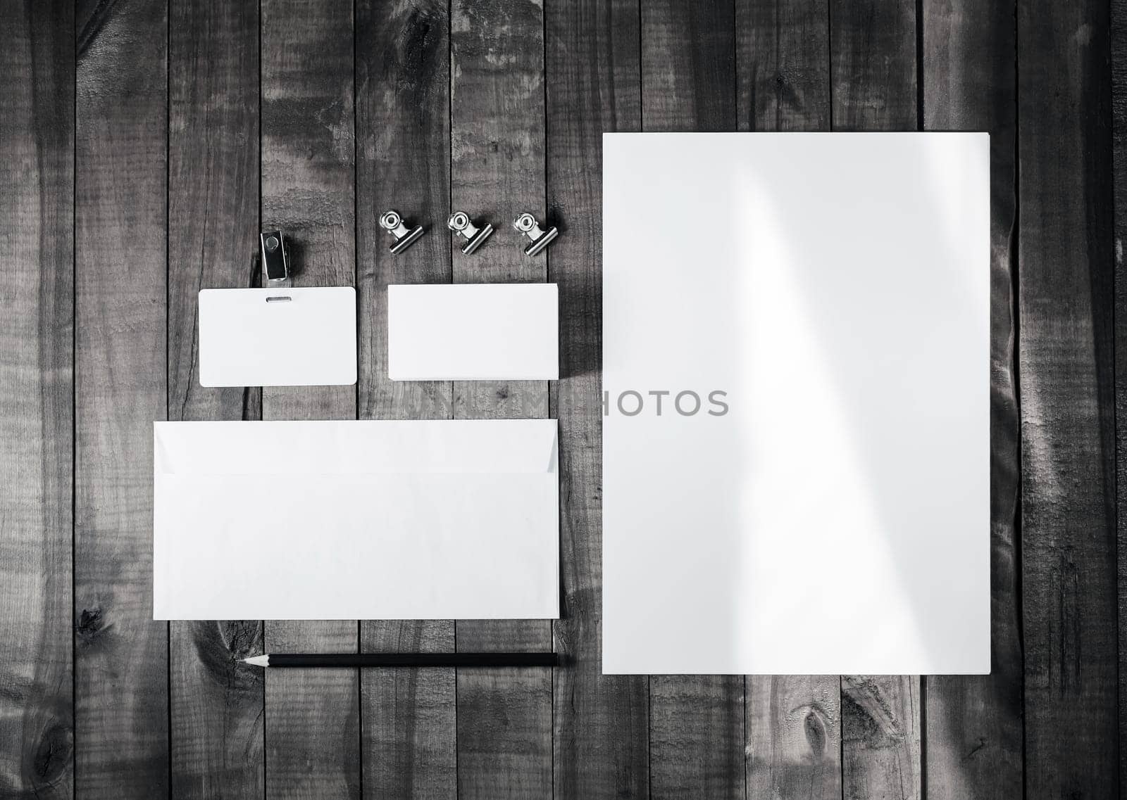 Blank corporate stationery on wood background. Branding mockup for placing your design. Top view.