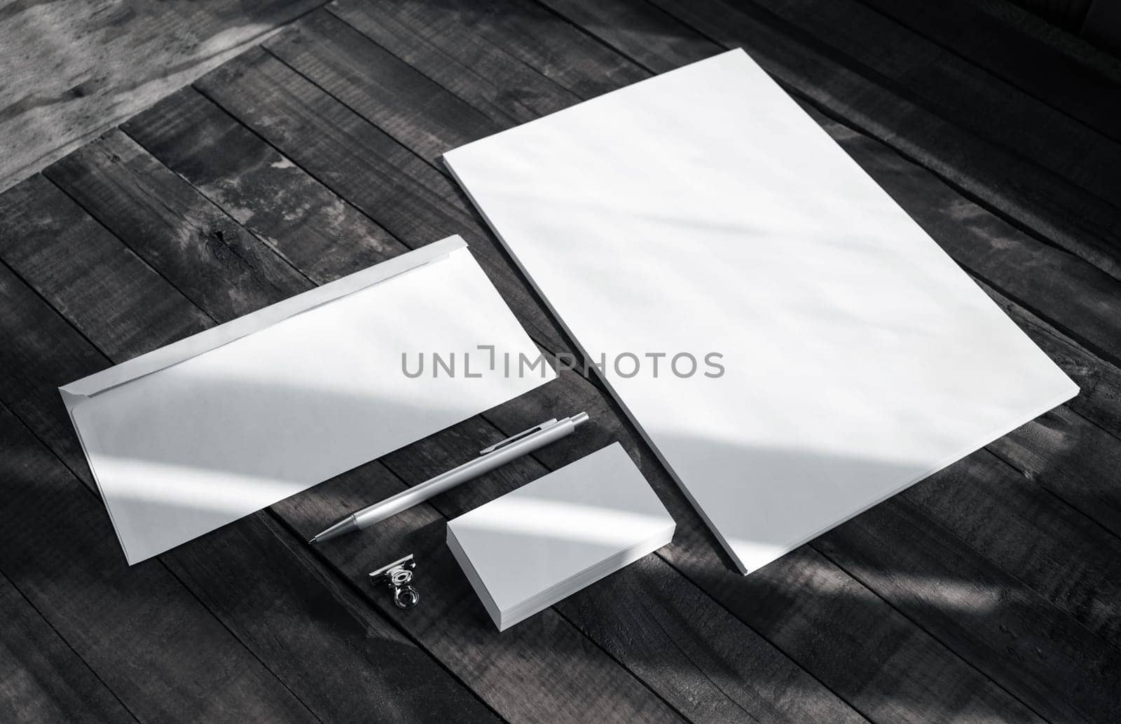Brand identity template. Photo of blank corporate stationery set on wooden table background.