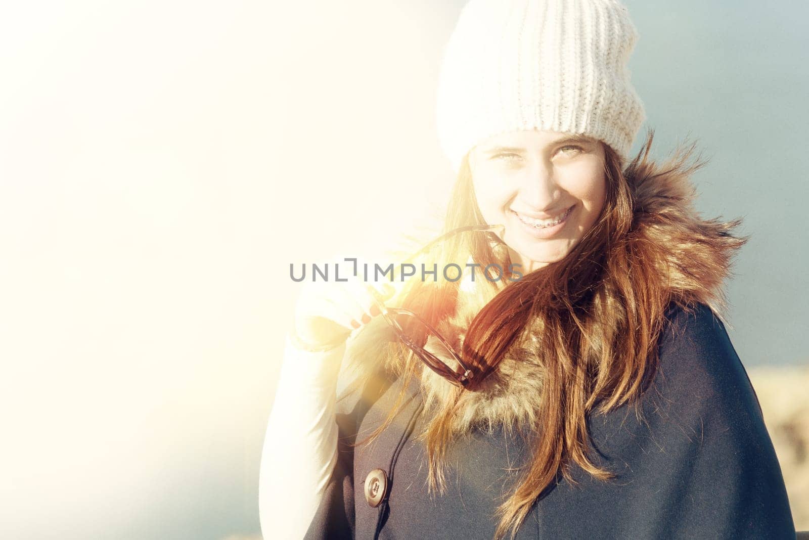 Beautiful and happy young girl posing outdoors