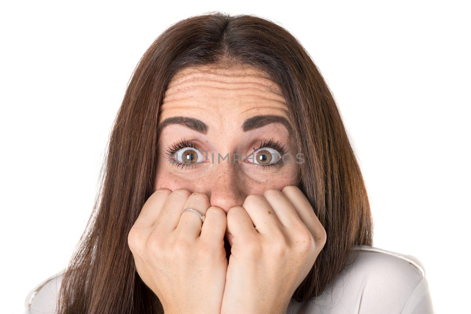 Stressed casual young woman isolated in a white background