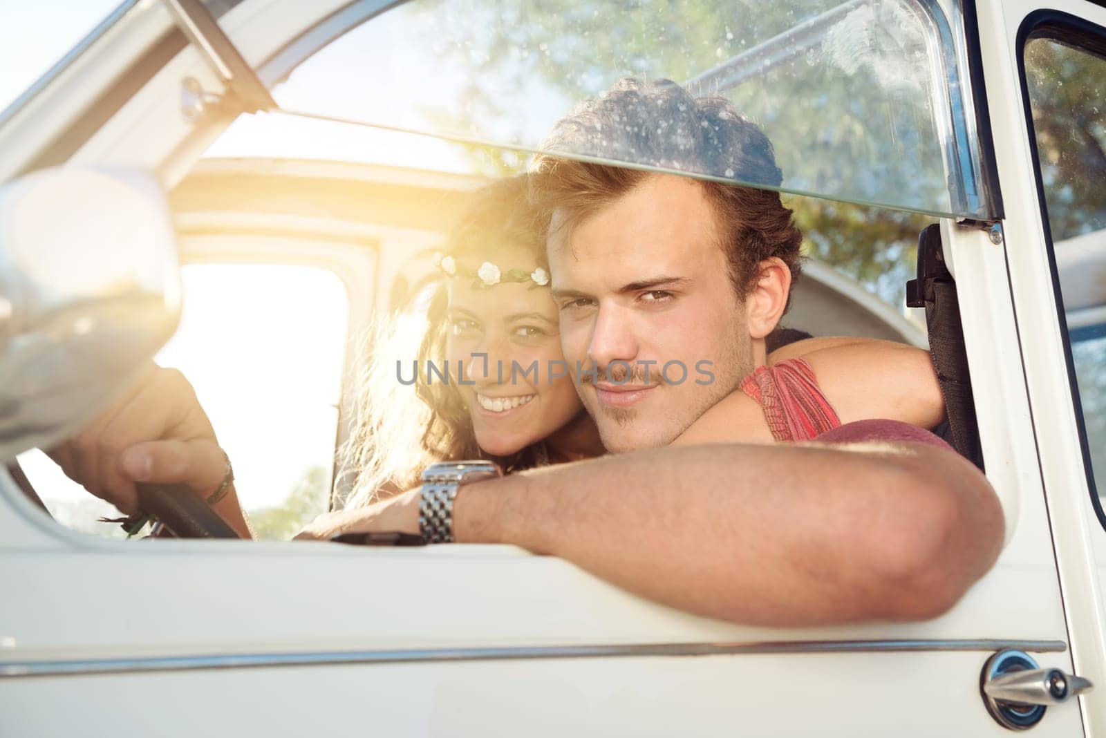 Young couple in a retro car at sunset, retro style.