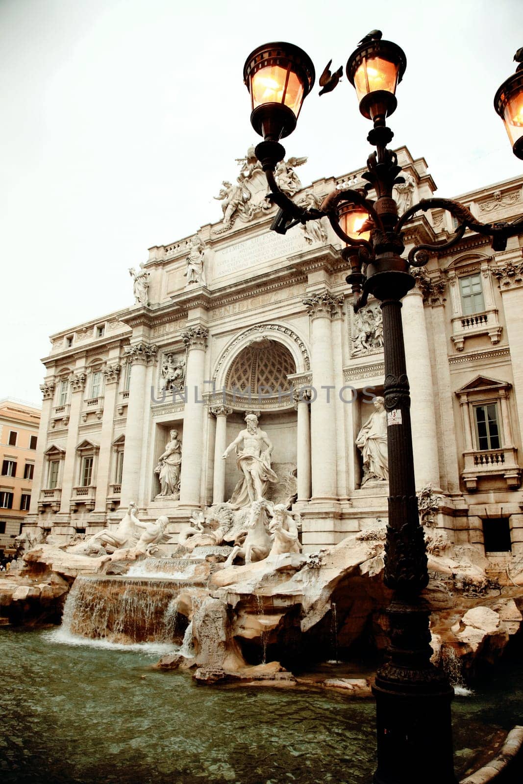 Trevi Fountain, baroque style, famous tourism attraction in Rome, Italy