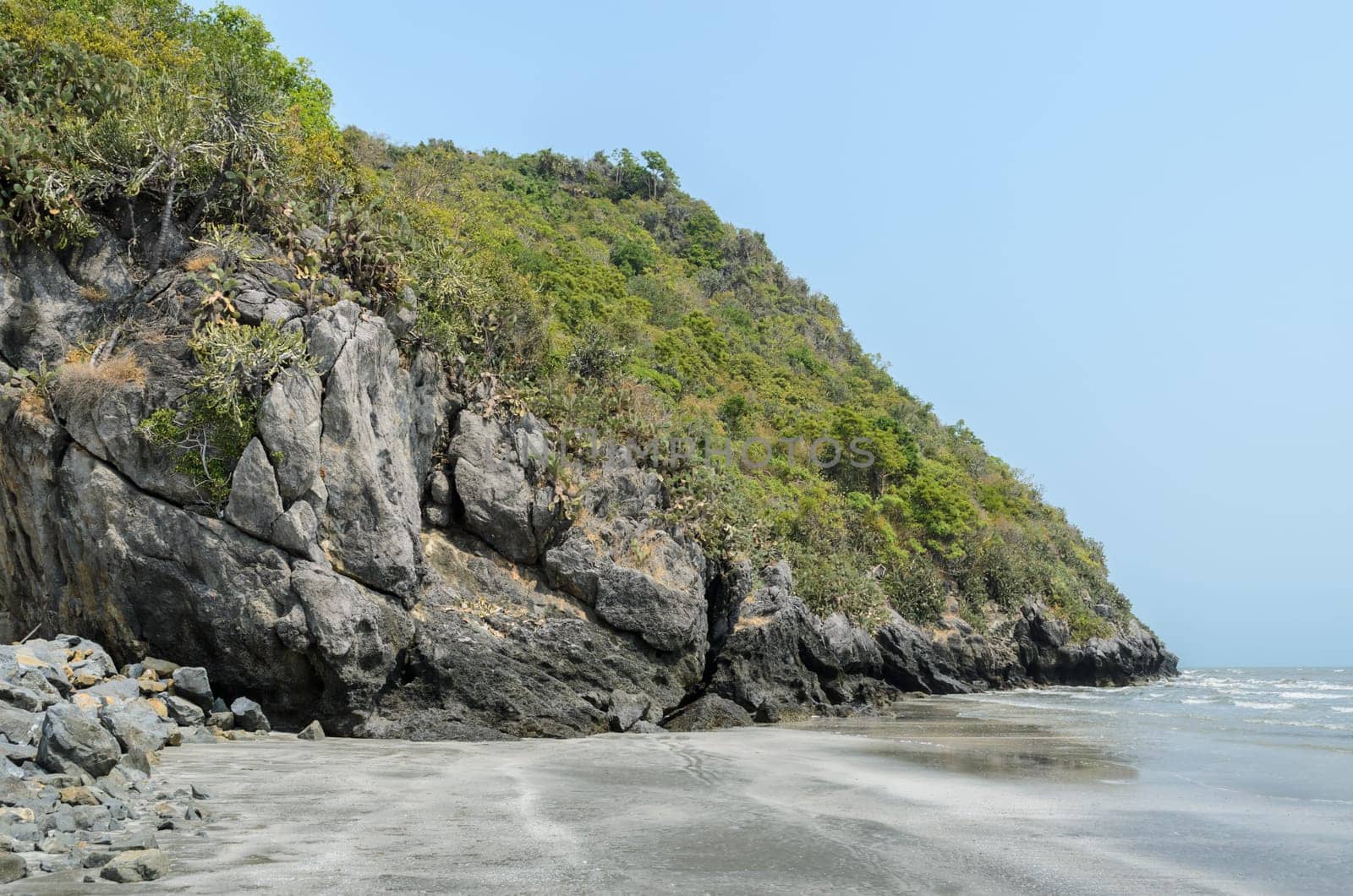 Tropical beach with rocky mountain