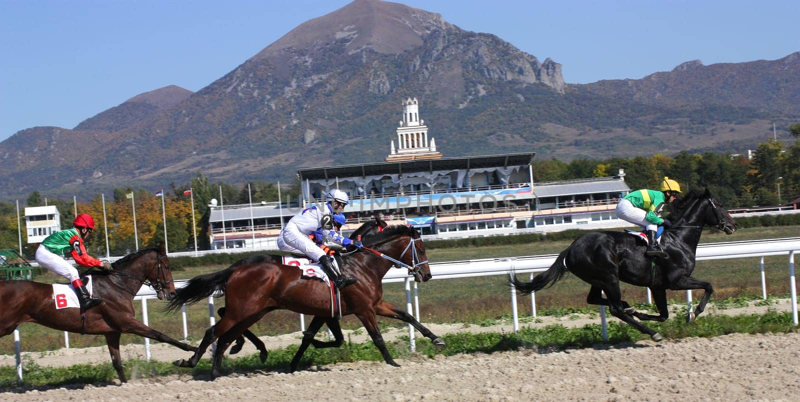 PYATIGORSK, RUSSIA - OCTOBER 9: Jockeys (L - R) Ilgiz Saitgaleev,Timur Guseinov and Imran Mardanov race for the prize of Osenni on October 9, 2011 in Pyatigorsk, Caucasus, Russia.