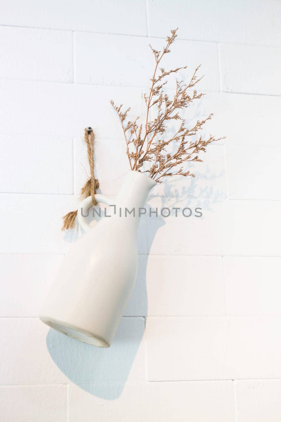 Dried little white flowers in vase, stock photo