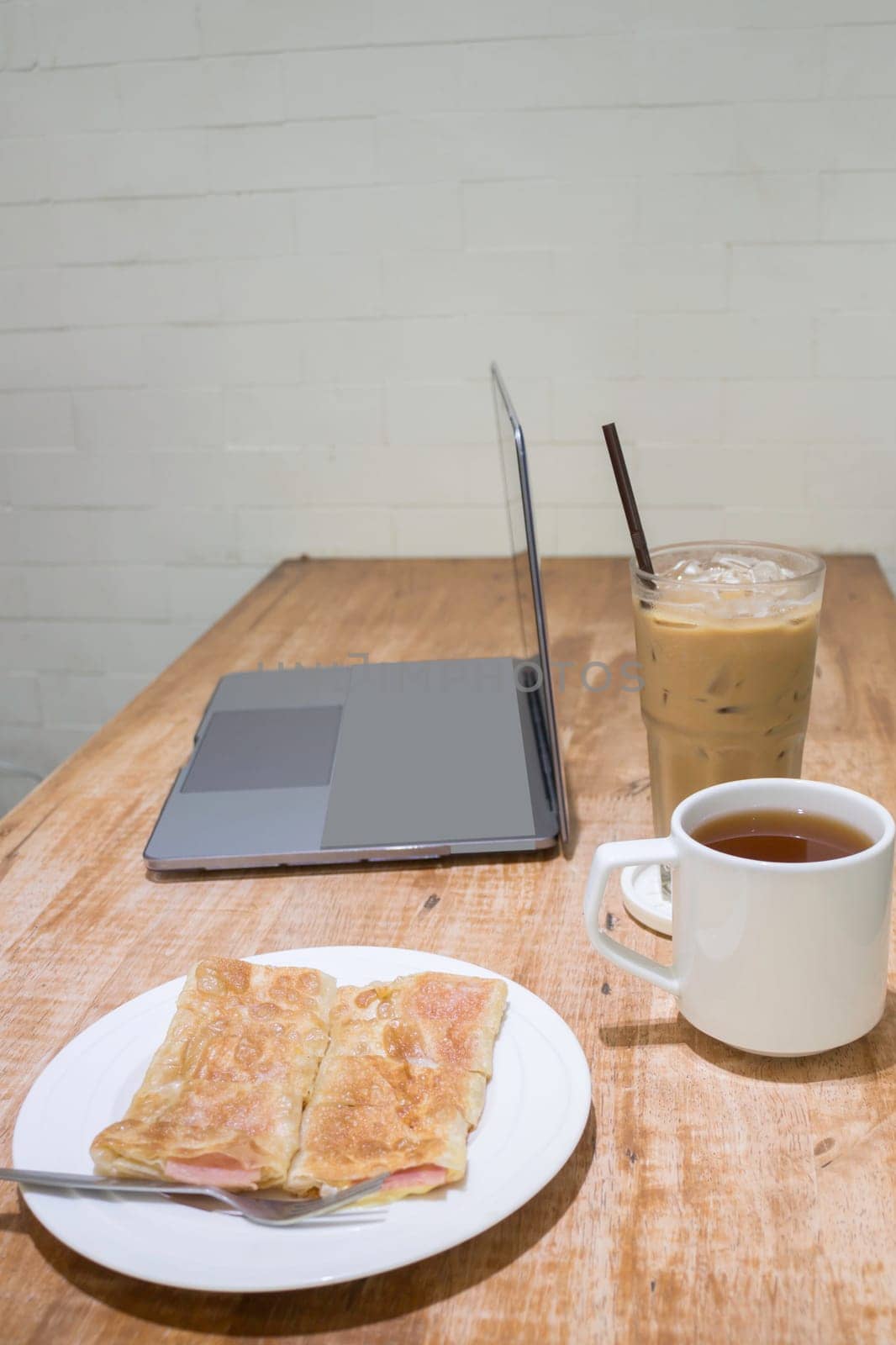 Easy meal in work hour with coffee drink and fried roti, stock photo
