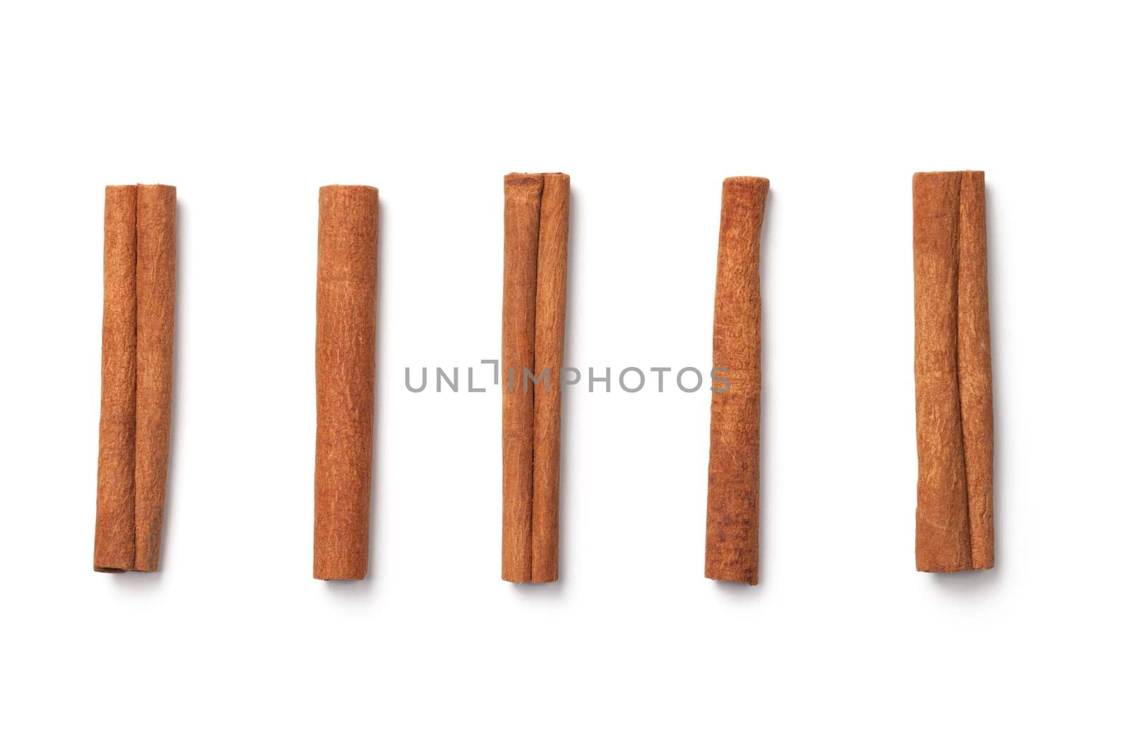 Cinnamon sticks isolated on white background. Top view