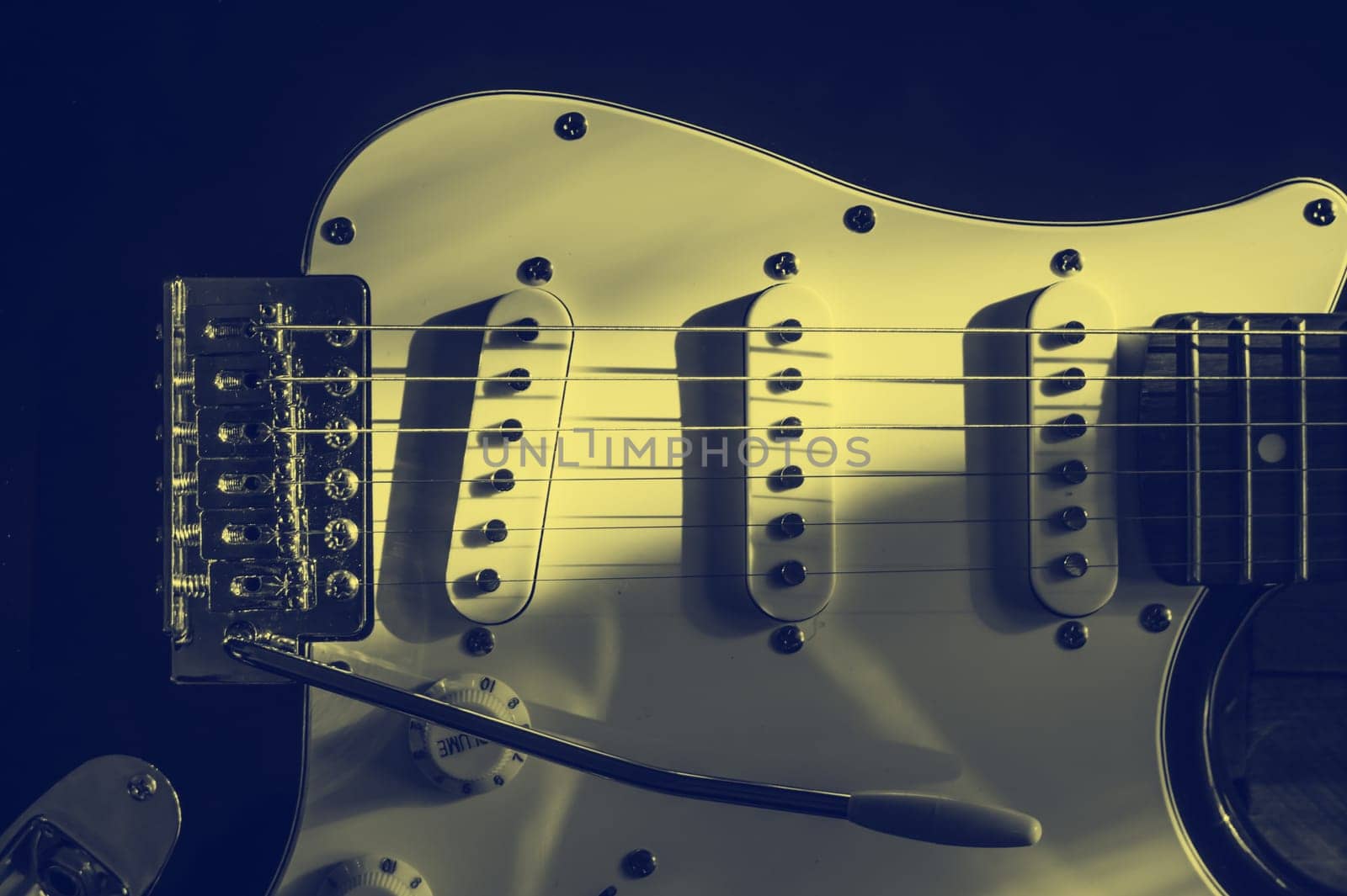 Vintage guitar stratakaster system close up. Yellow blue toning.