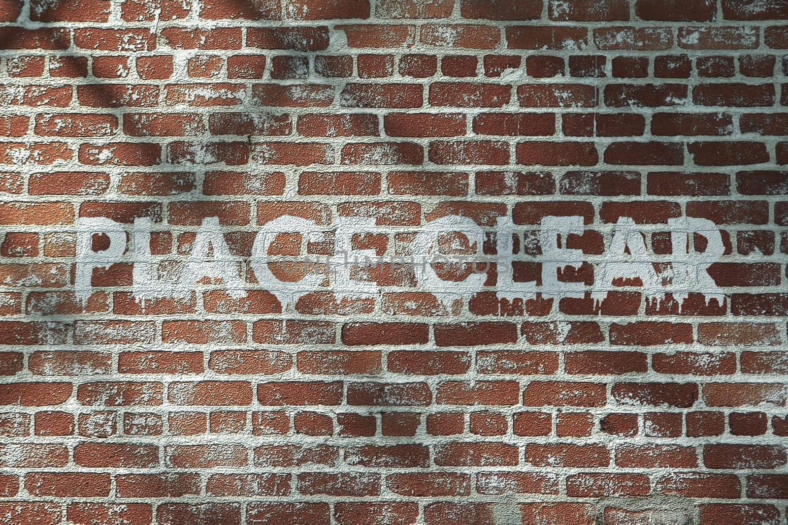 red old brick wall with a writing on