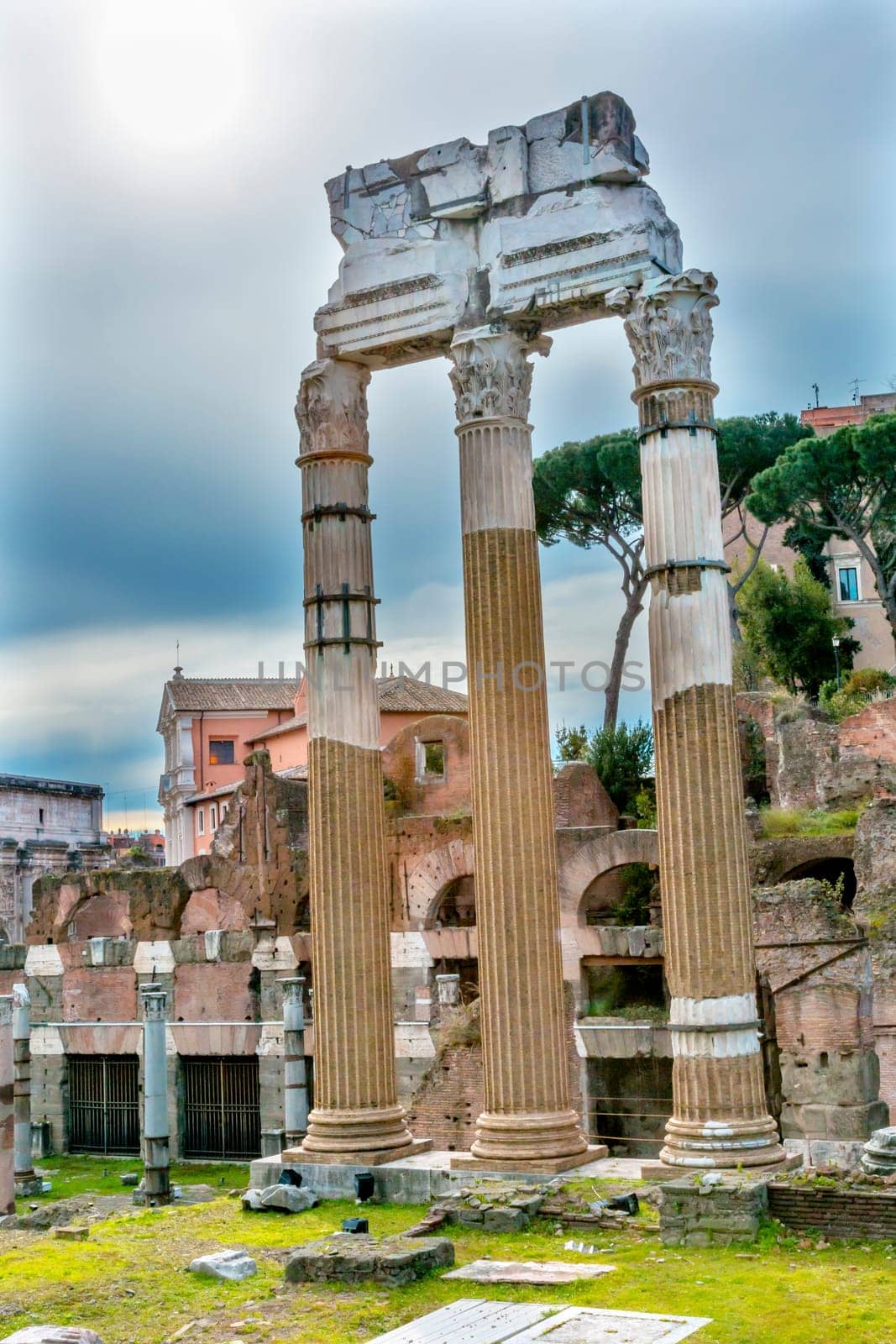 Temple of Vespasian and Titus Corinthian Columns Roman Forum Rome Italy.  Temple created in 79 AD by Emperor Titus, finished by Emperor Vespacian