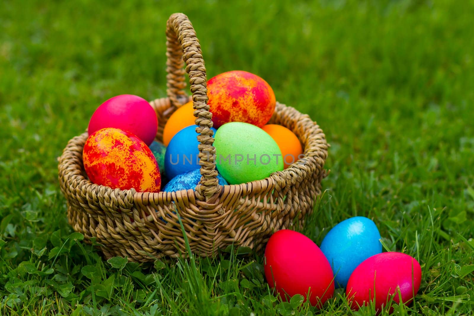 Happy Easter, colorful eggs in a basket