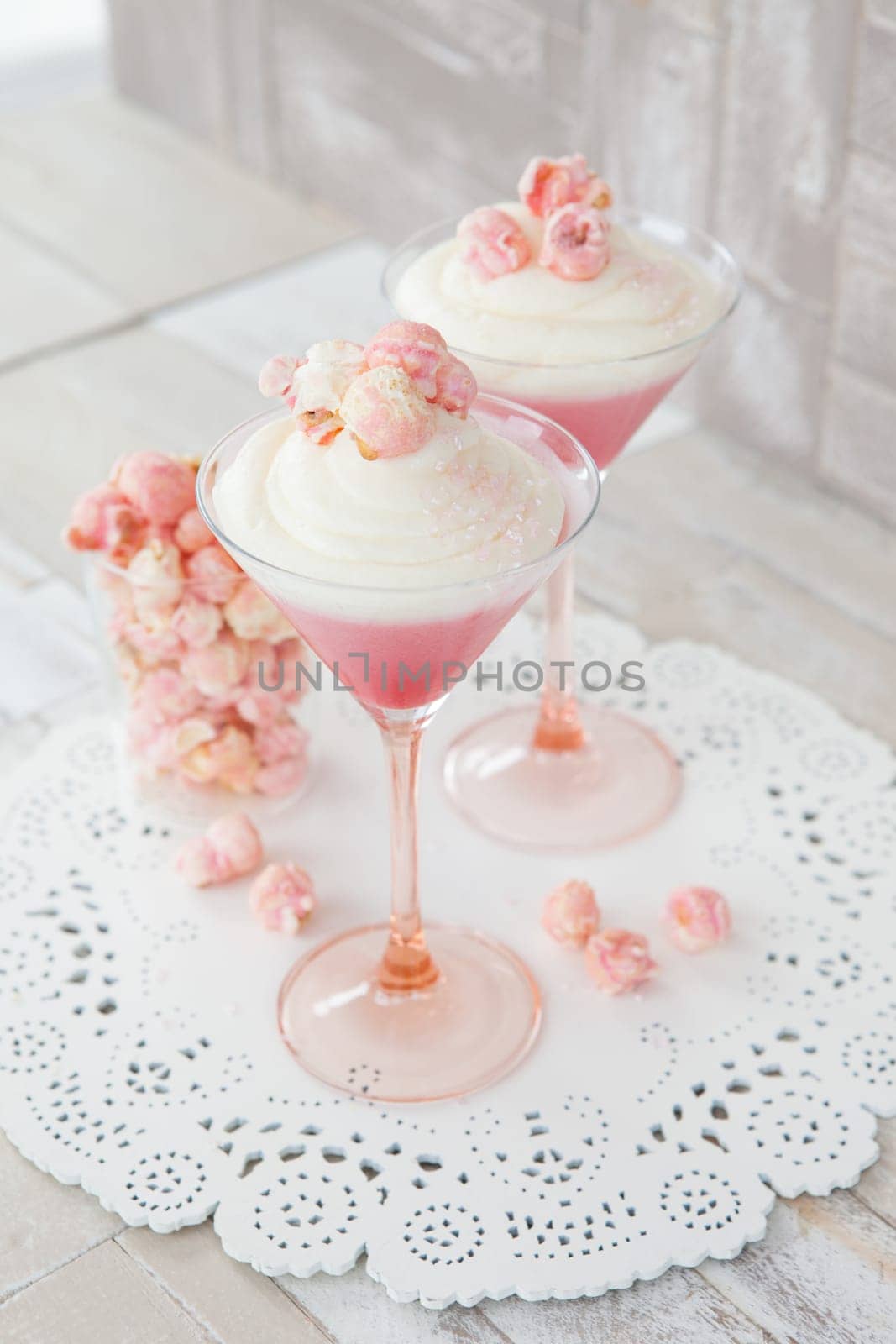 Cream dessert with popcorn in a martini glass