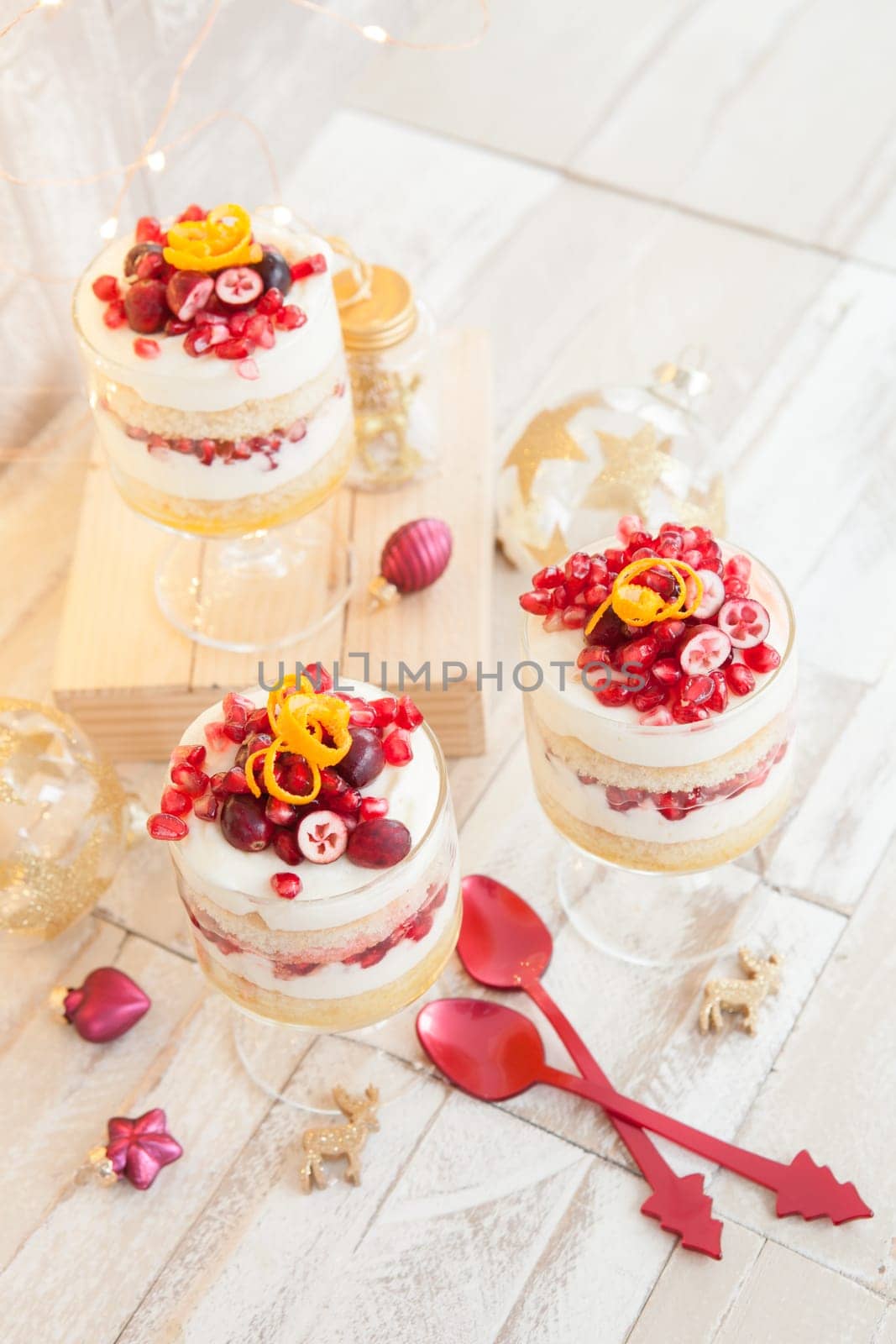 Dessert in layers with white chocolate mousse,orange and pomegranate