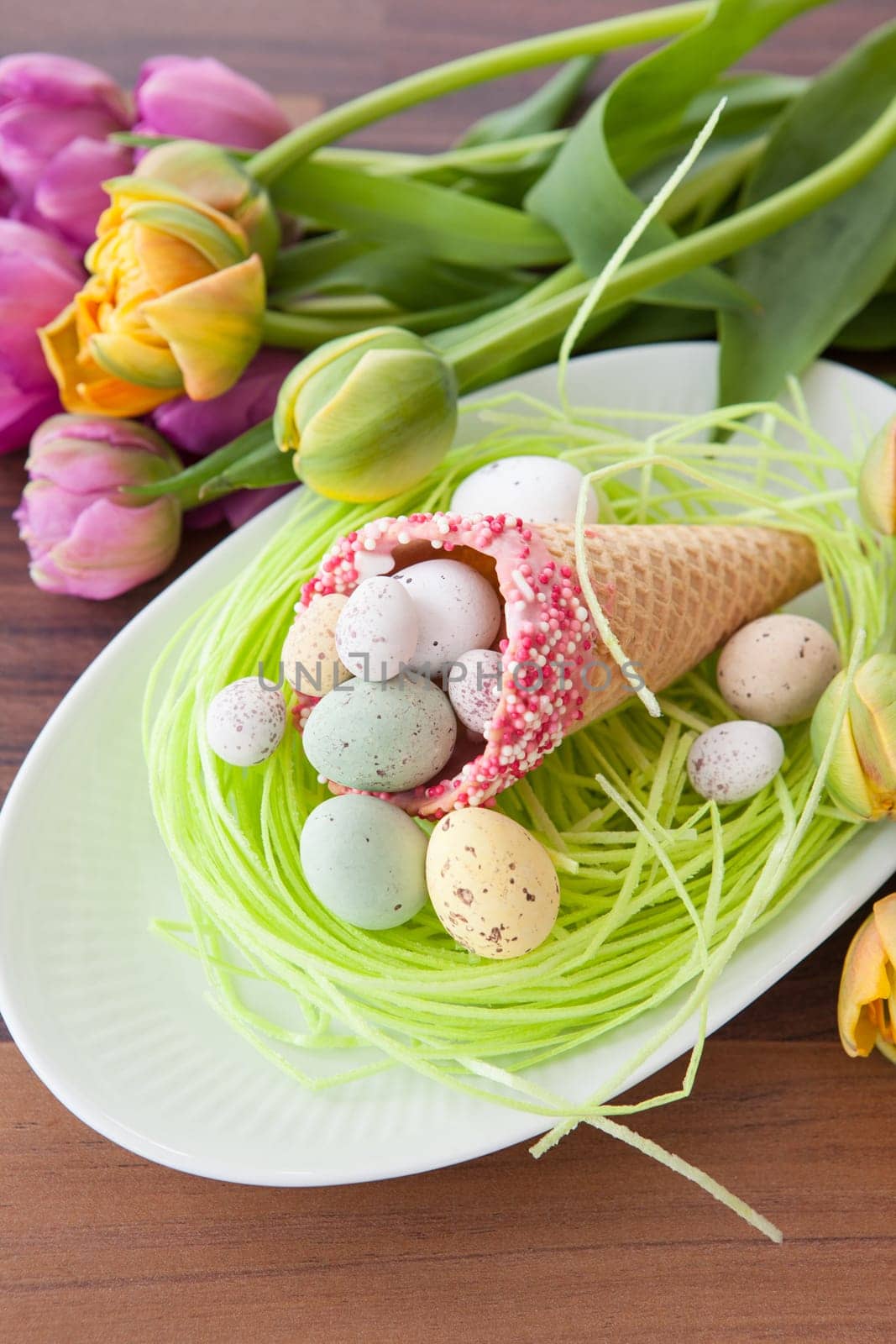 Easter eggs in waffle toe on Easter nest made of dish paper