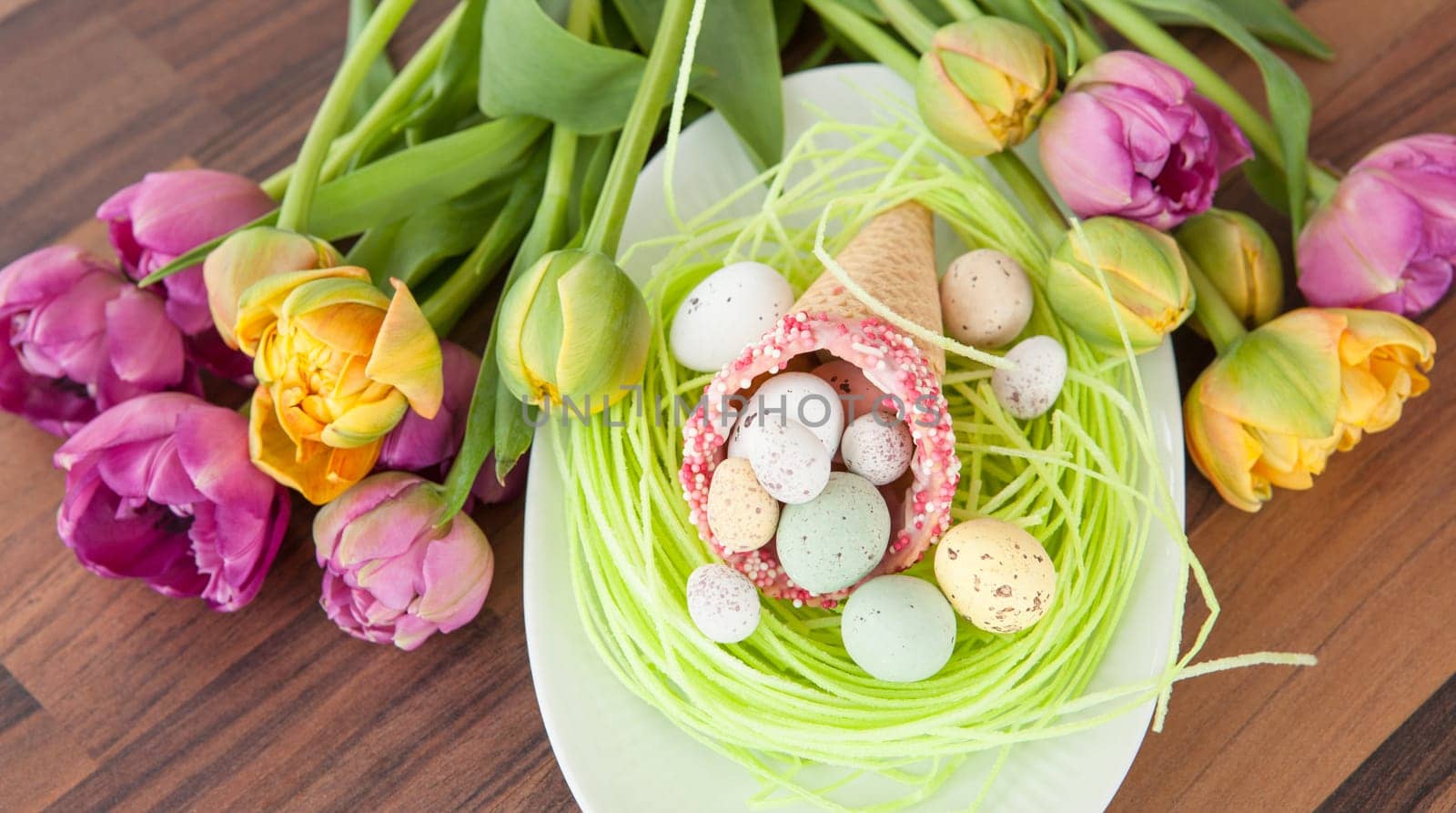 Easter eggs in waffle toe on Easter nest made of dish paper