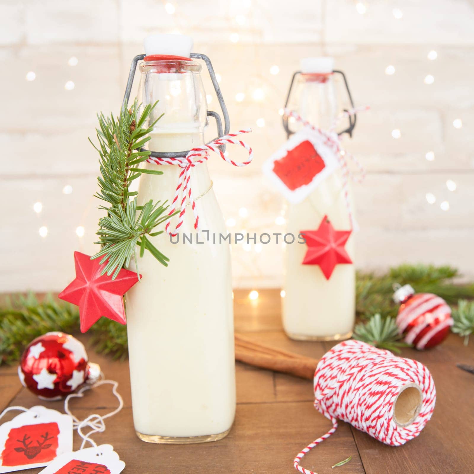 Bottle of egg punch with colorful decoration for Christmas
