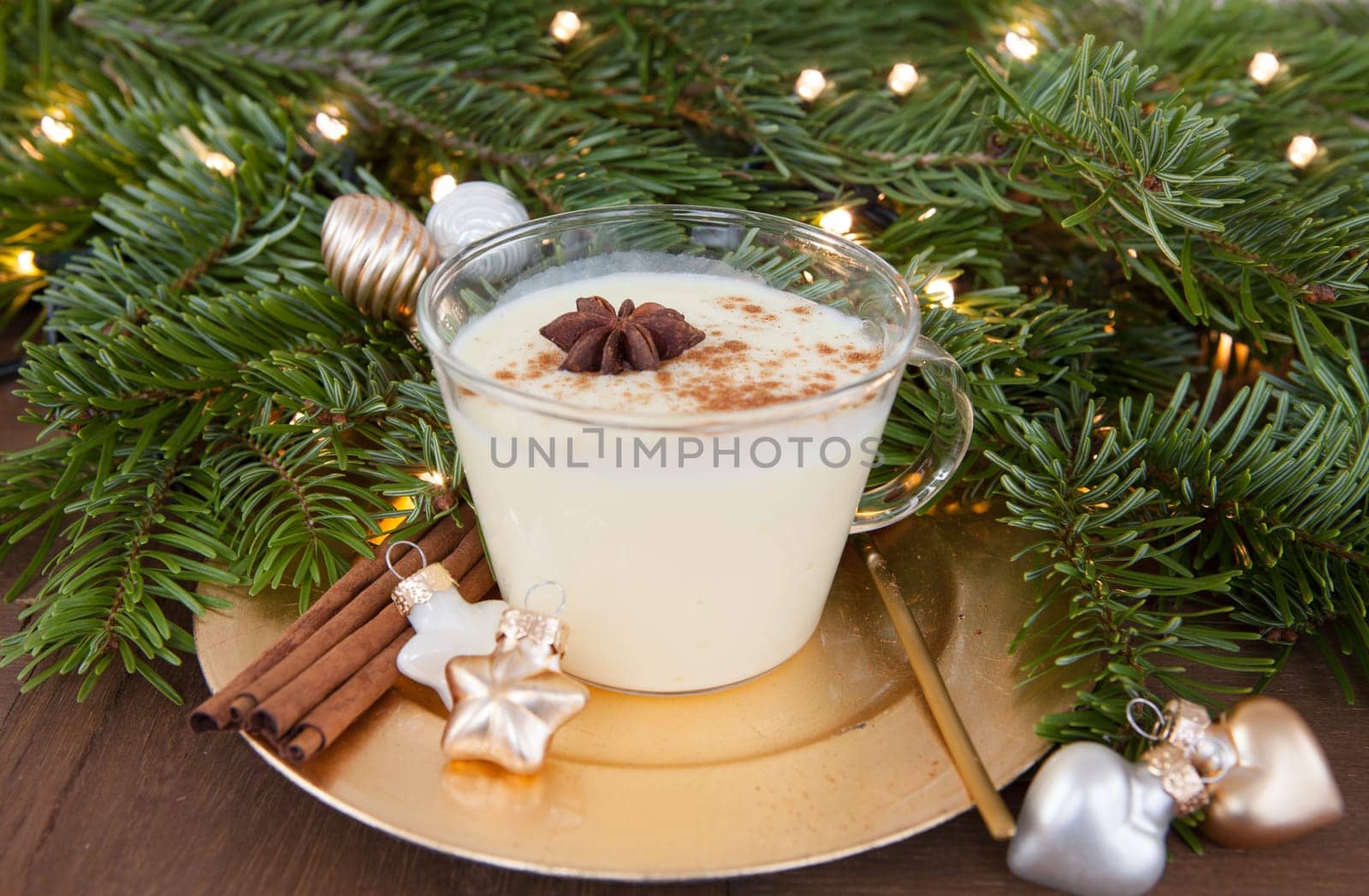 Cup of egg punch with cinnamon and anise for Christmas