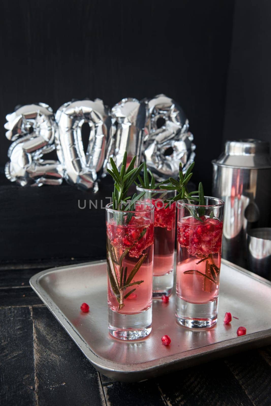 Festive drink with rosemary and pomegranate