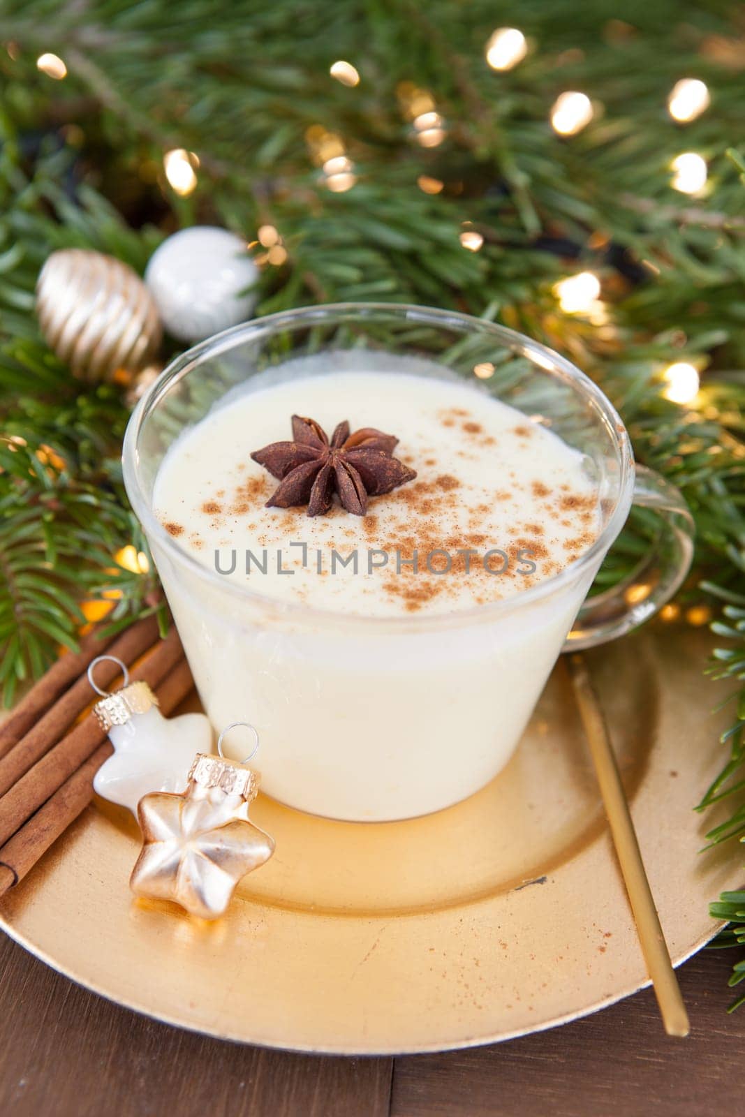 Cup of egg punch with cinnamon and anise for Christmas