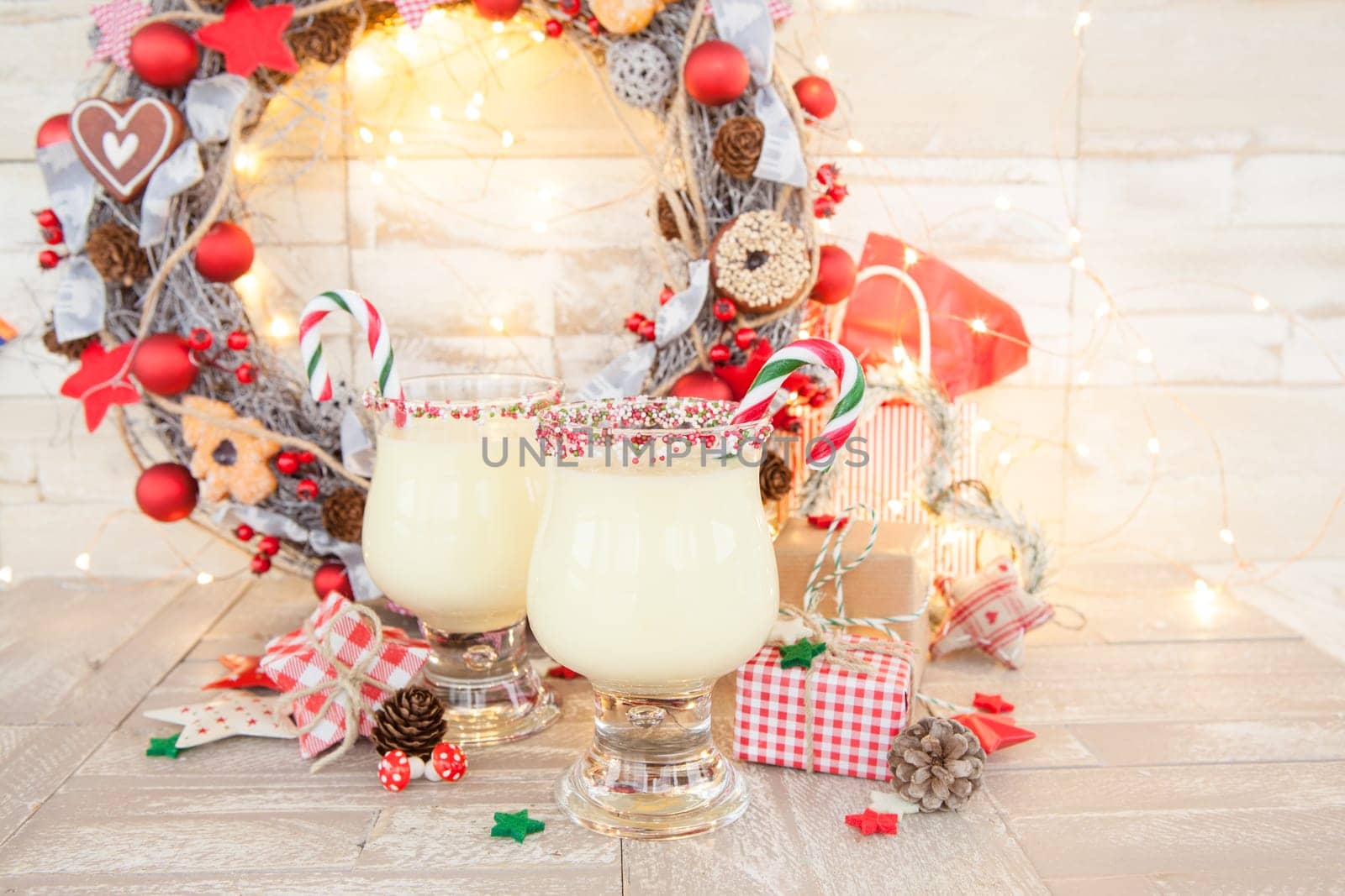 Egg punch with candy cane with colorful decoration for Christmas