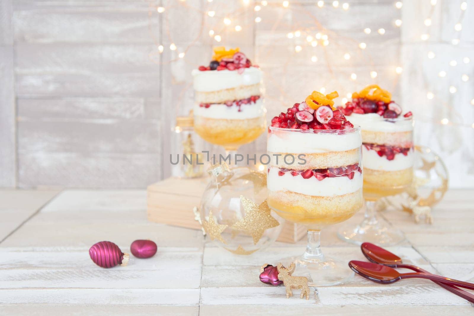 Dessert in layers with white chocolate mousse,orange and pomegranate