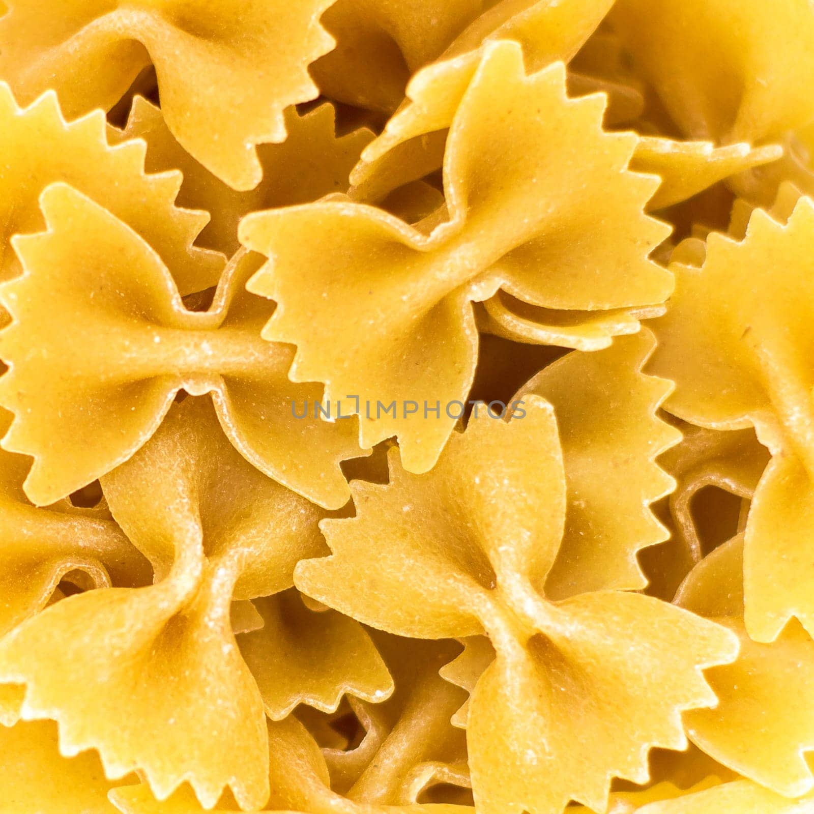 Uncooked farfalle pasta as background