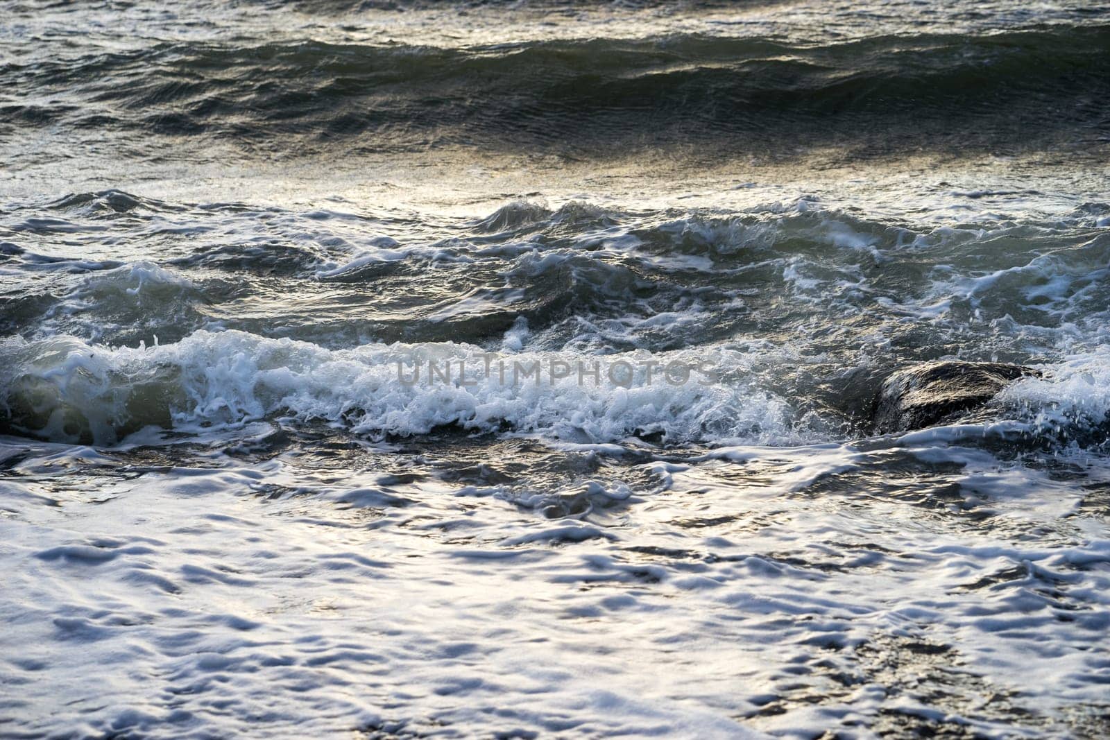 waves of foam spray in the ocean