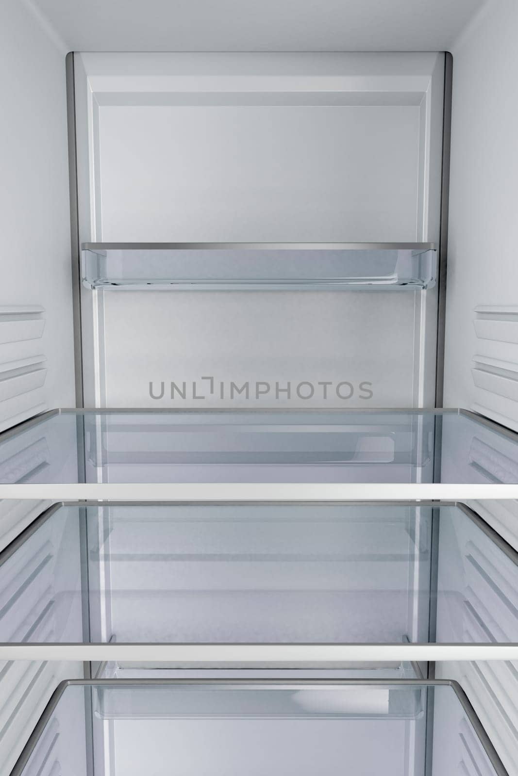 View from inside of an empty fridge with closed door