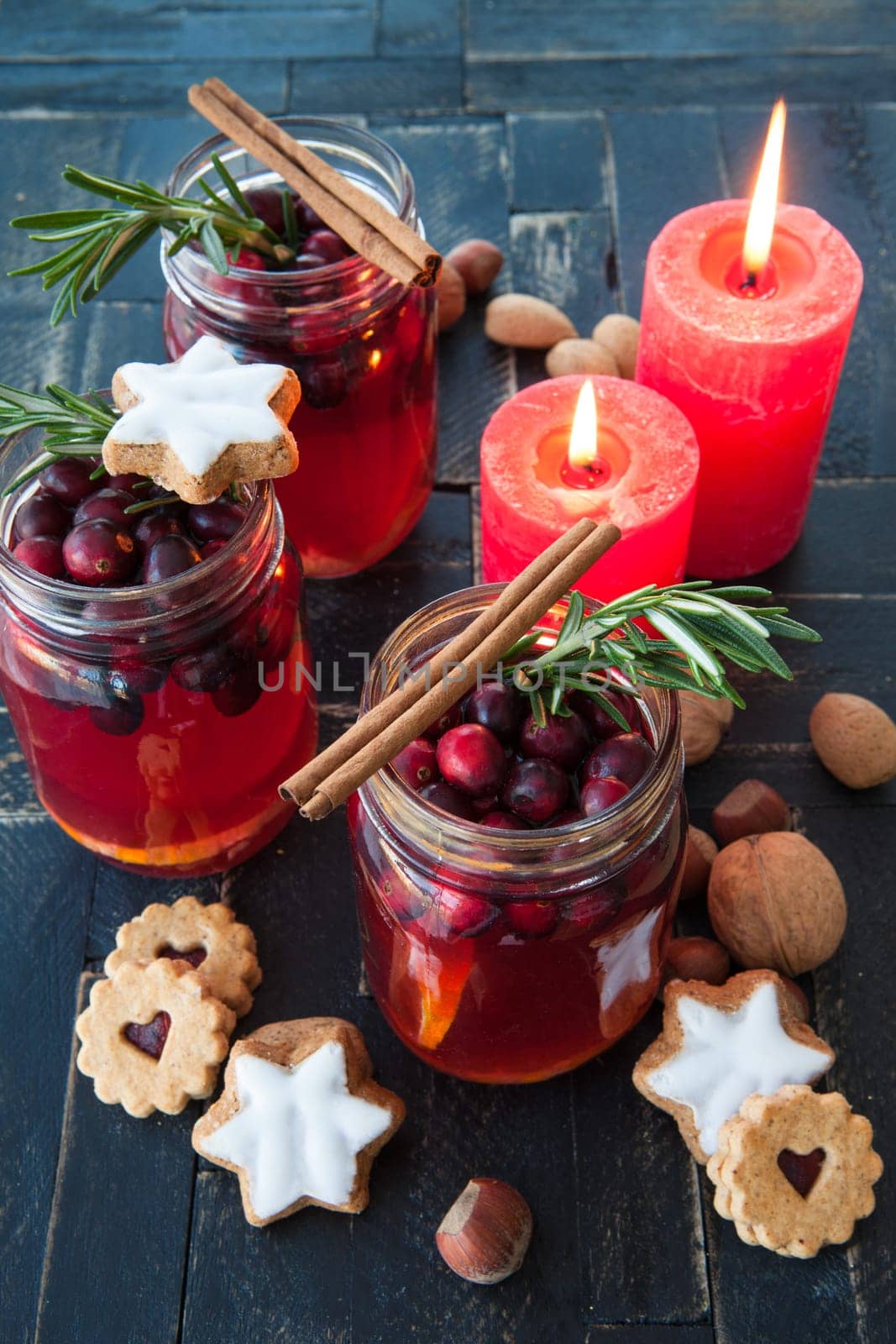 Hot punch with cranberry,cinnamon and rosemary