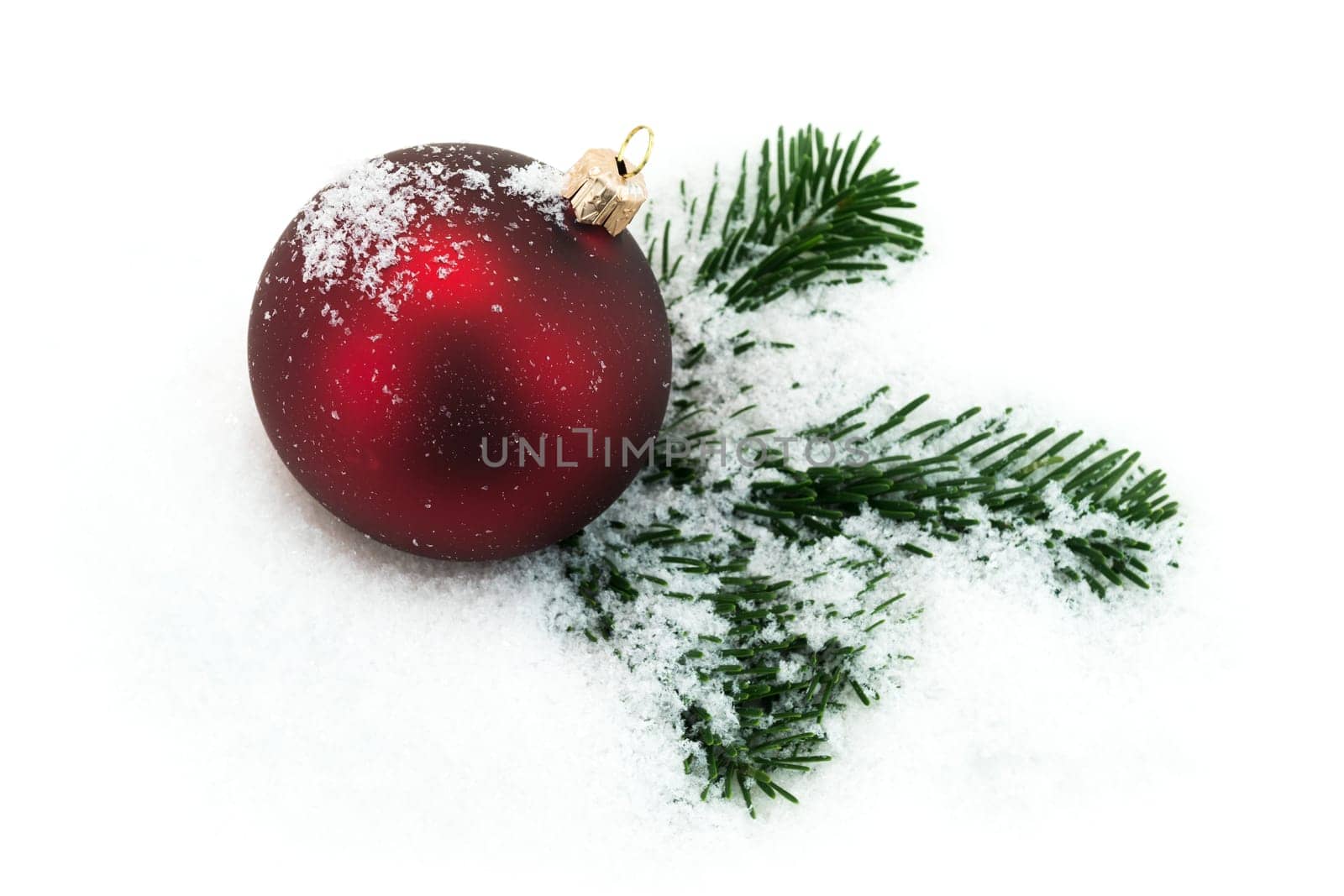 Christmas ball in the snow,Christmas decoration with fir branch