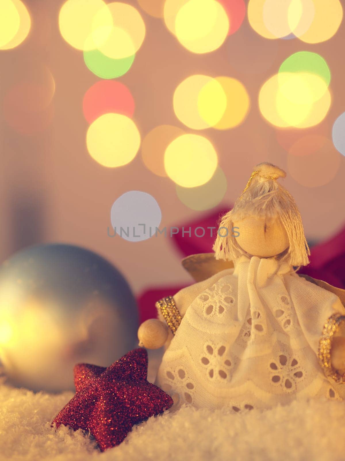 Christmas background with an angel and decoration in snow