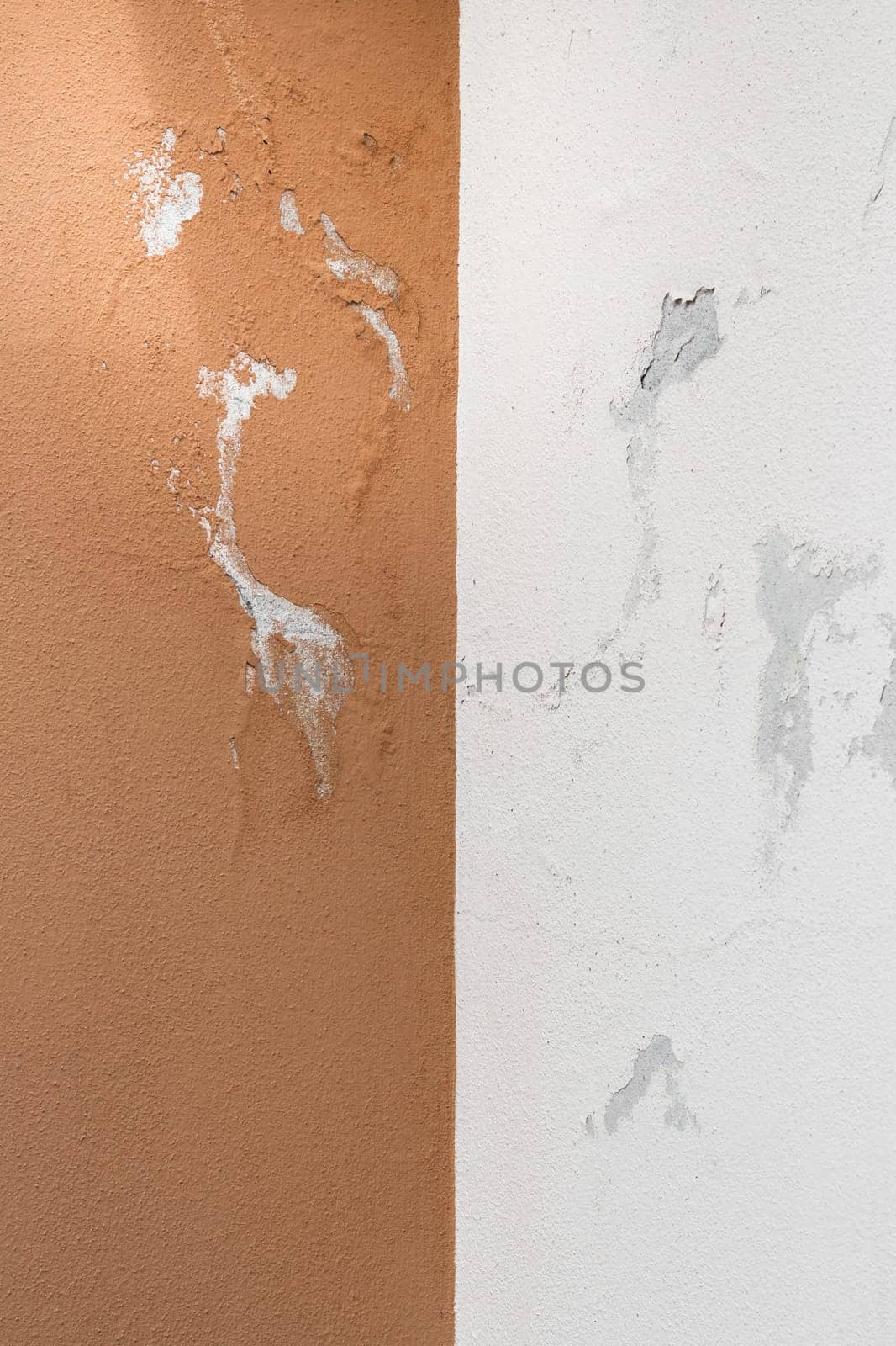 Peeling painted wall, texture, grunge background, cracked paint with orange wall.
