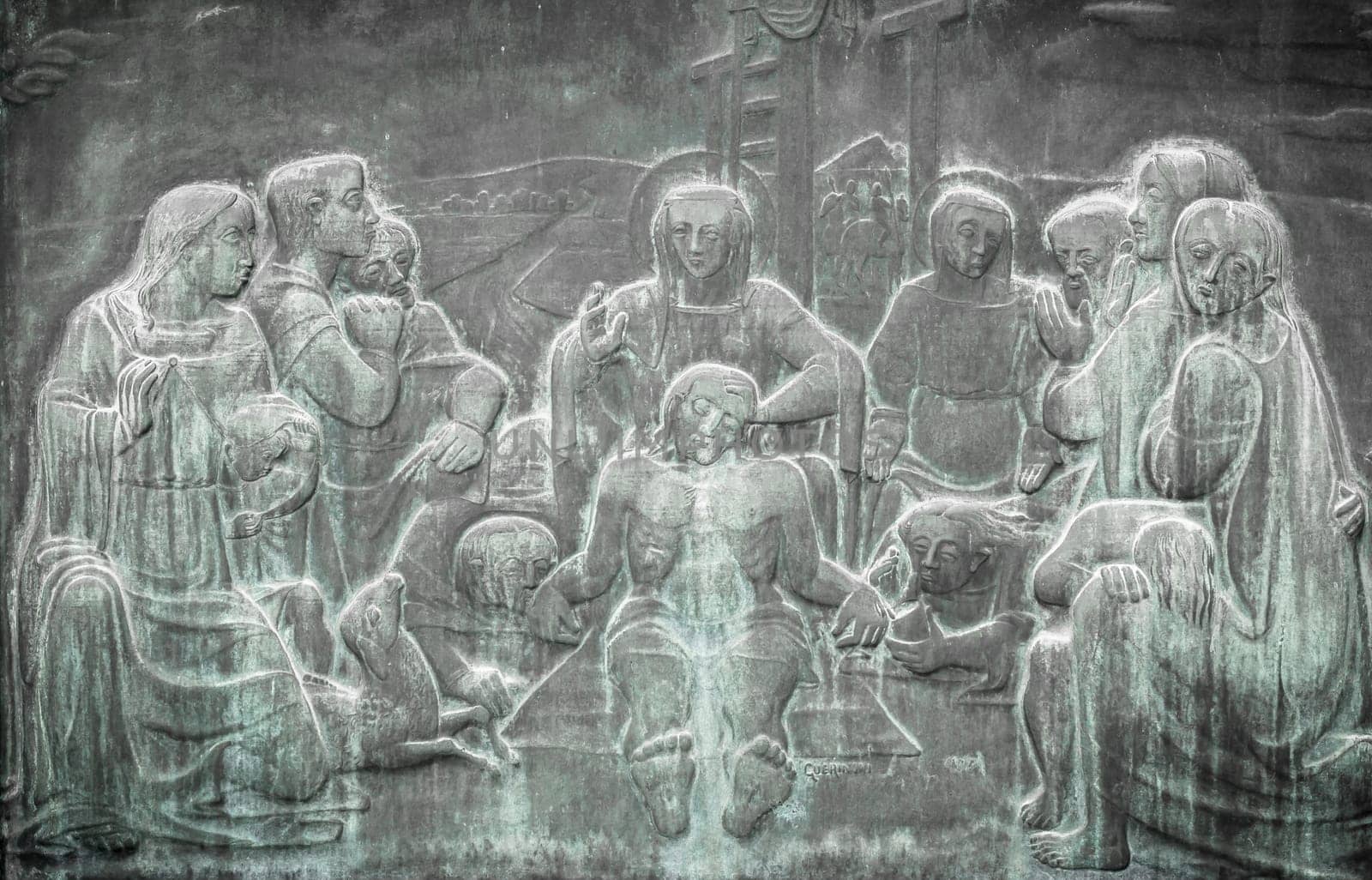 Stone wall engraving scene depicting the Lamentation of Christ