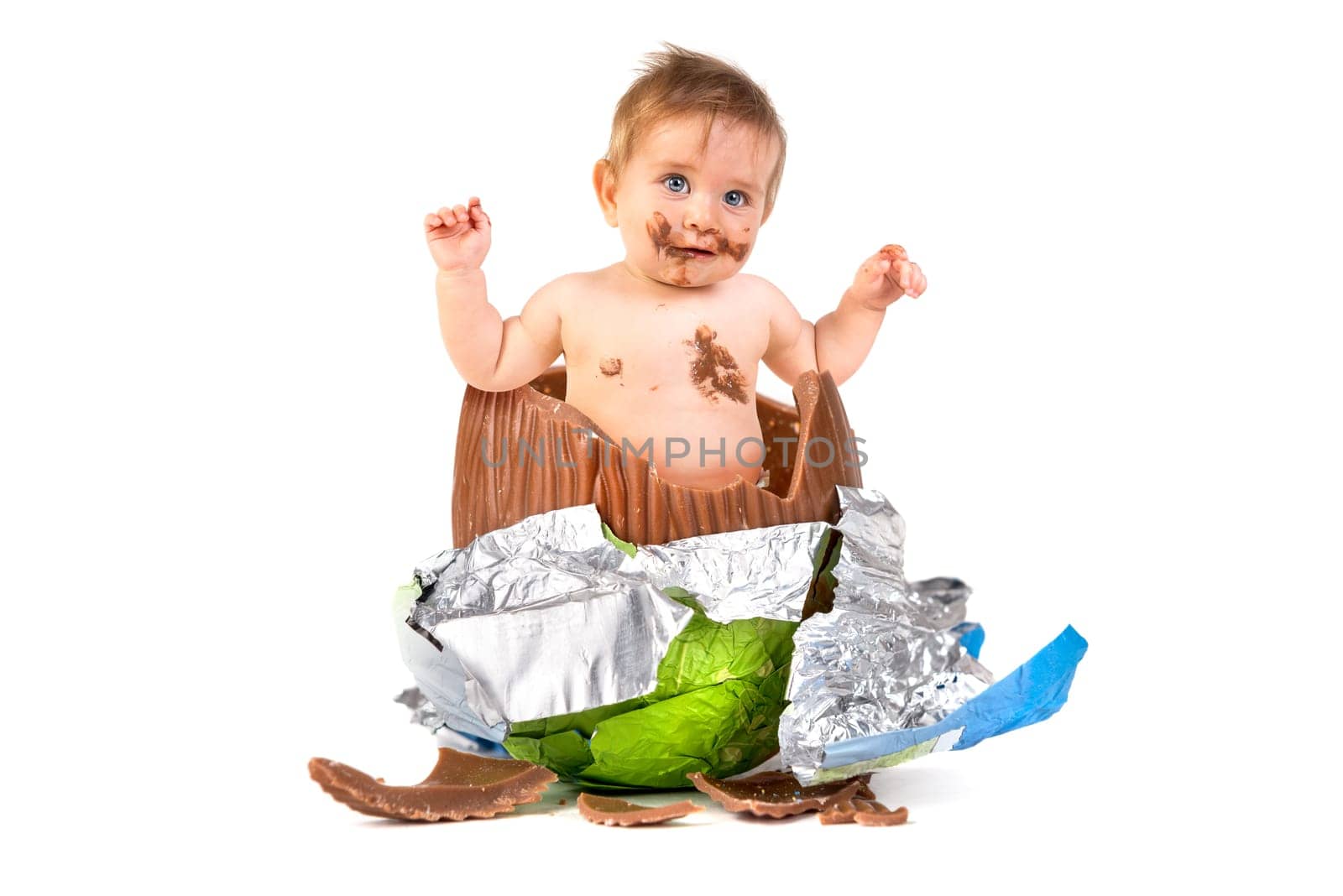 Sweet baby inside an Easter egg isolated in white