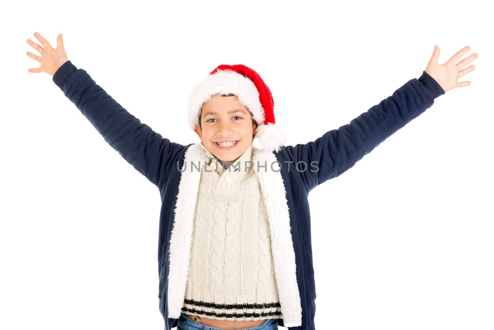 Happy young boy with Santa's hat posing isolated in white