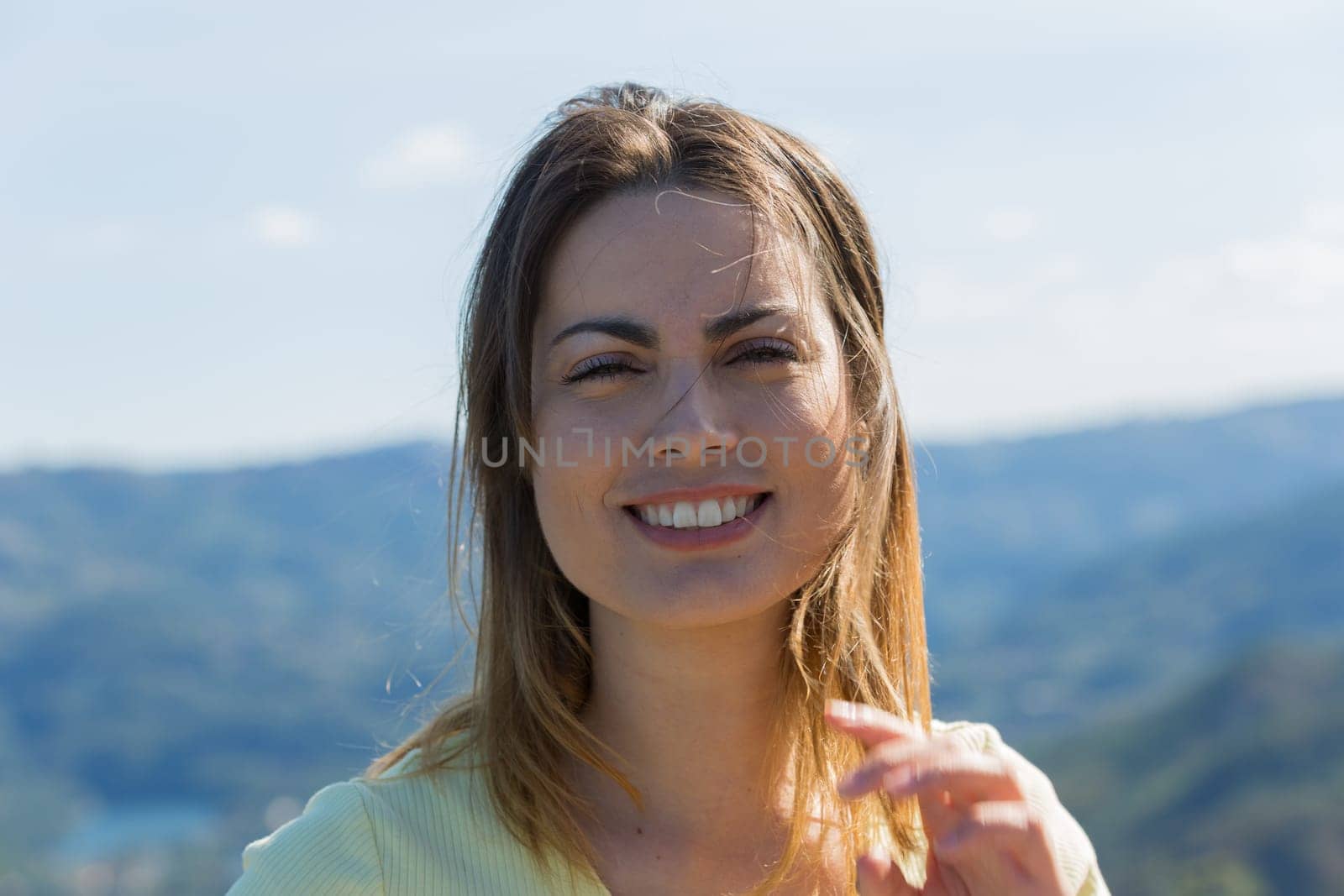 Portrait of a happy young woman, outdoor.