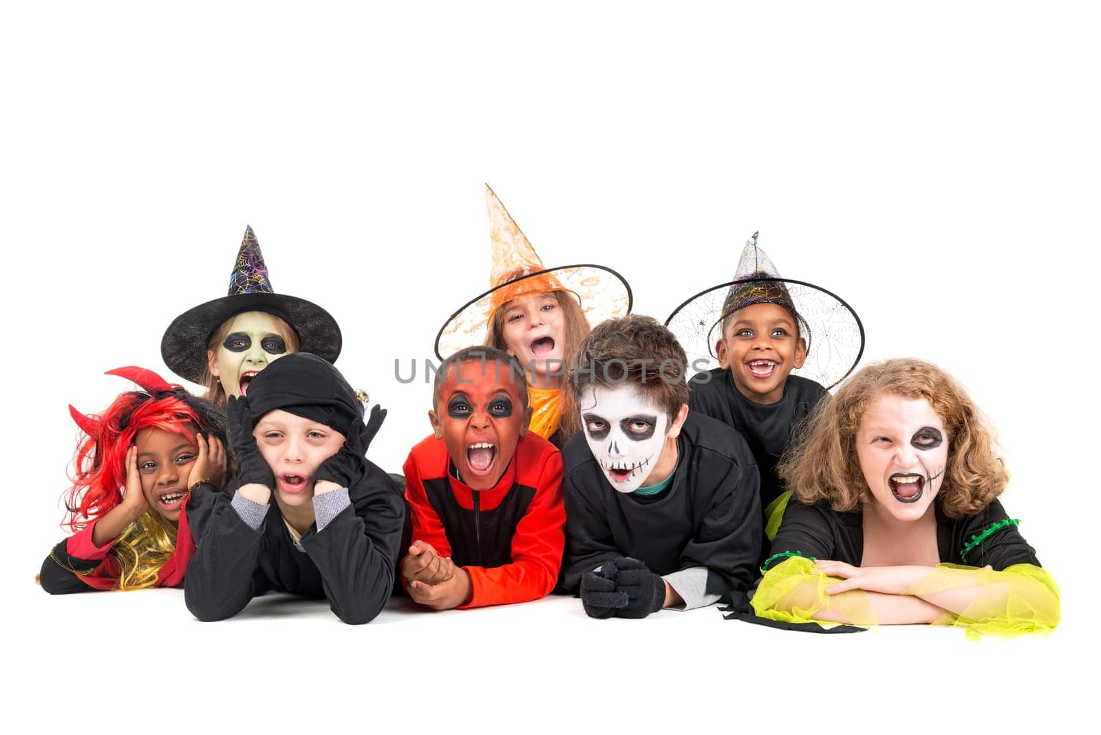Kids with face-paint and Halloween costumes isolated in white