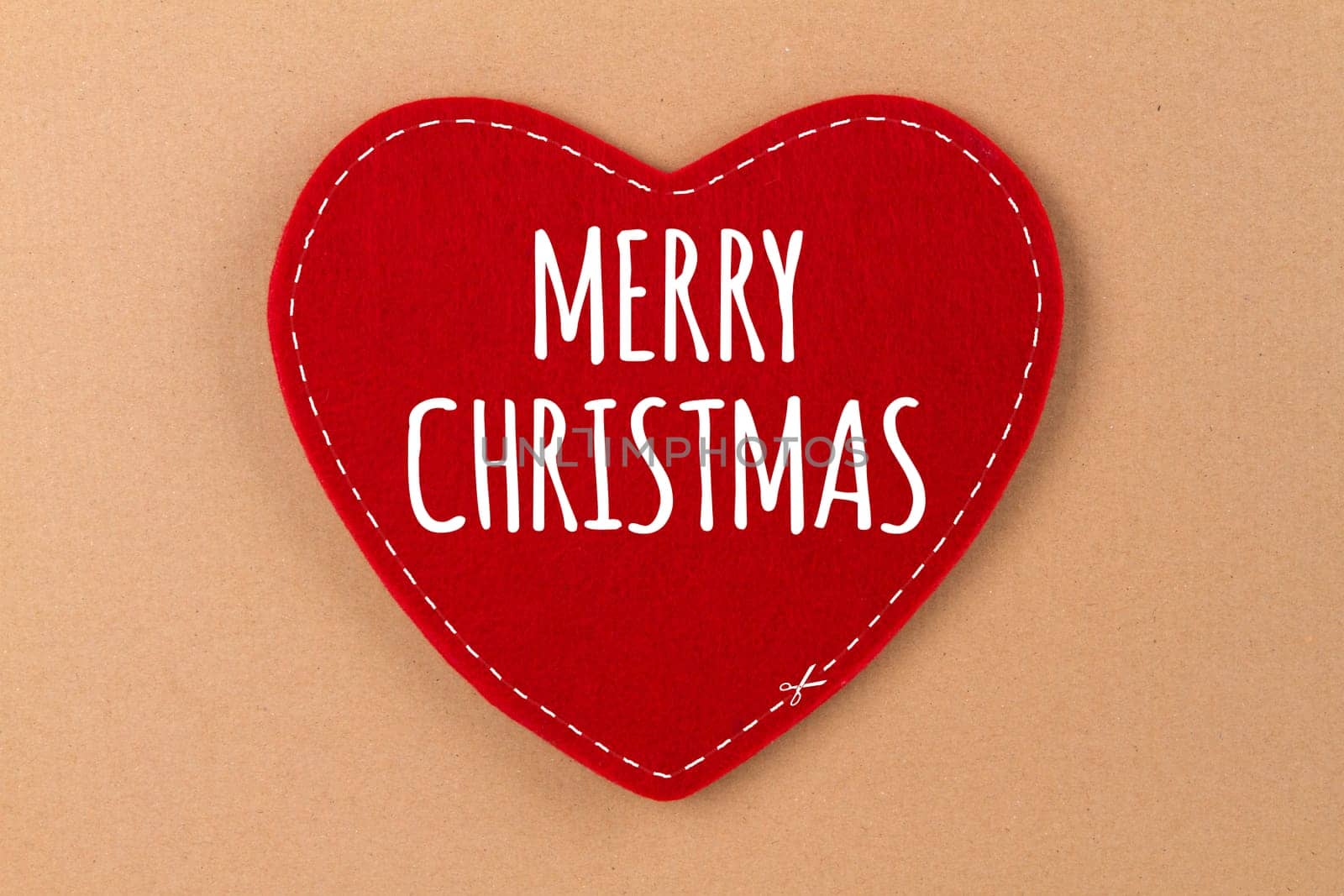 Heart on beige background with lettering - Merry Christmas
