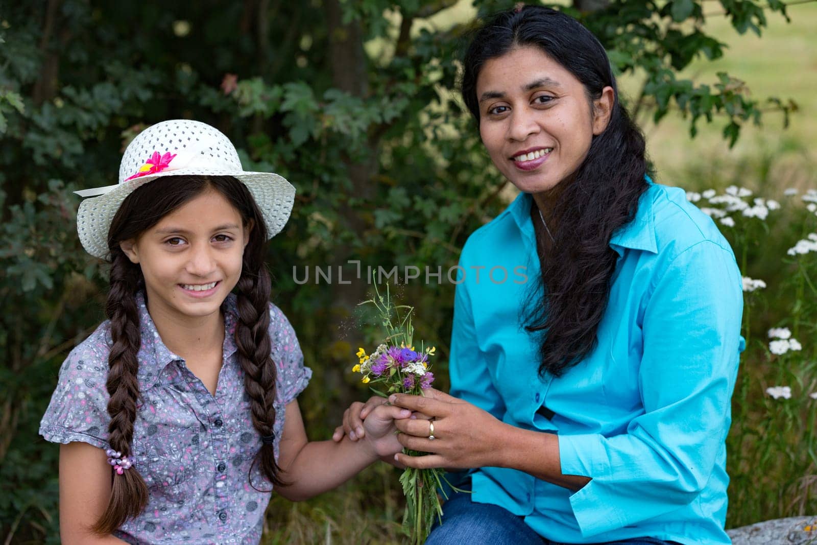 Girl gives mother a self-puffed bouquet of flowers