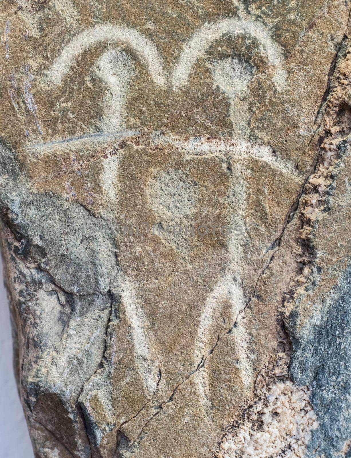 Badajoz, Spain - November 21, 2017: Dancing figures belonging to Warrior Stela of Zarza Capilla III. Badajoz Archeological Museum