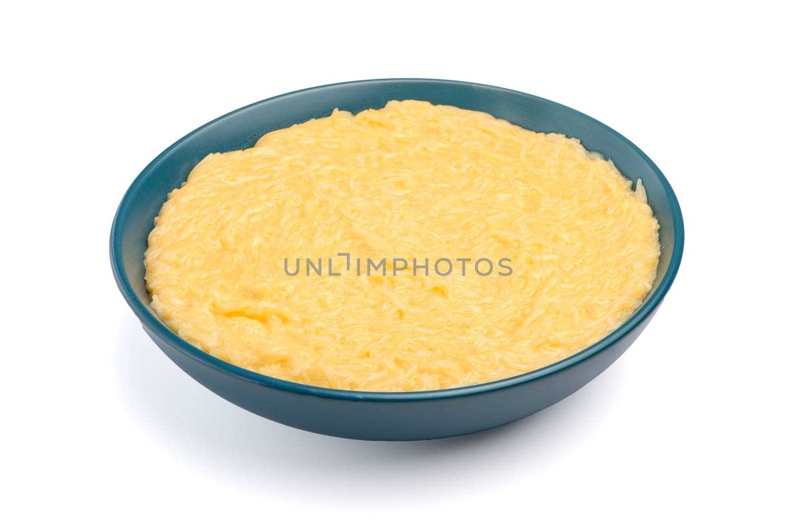 Vermicelli desert on a blue ceramic plate isolated on white background.