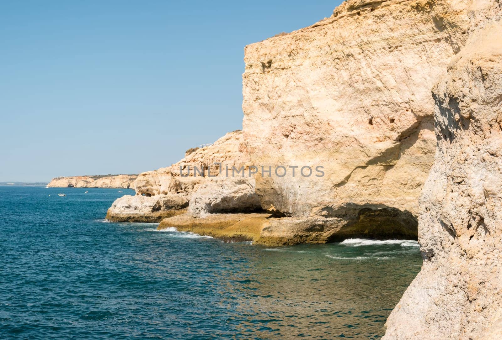 Summer Atlantic ocean rocky coastline near Carvoeiro town, Lagoa, Algarve - Portugal.