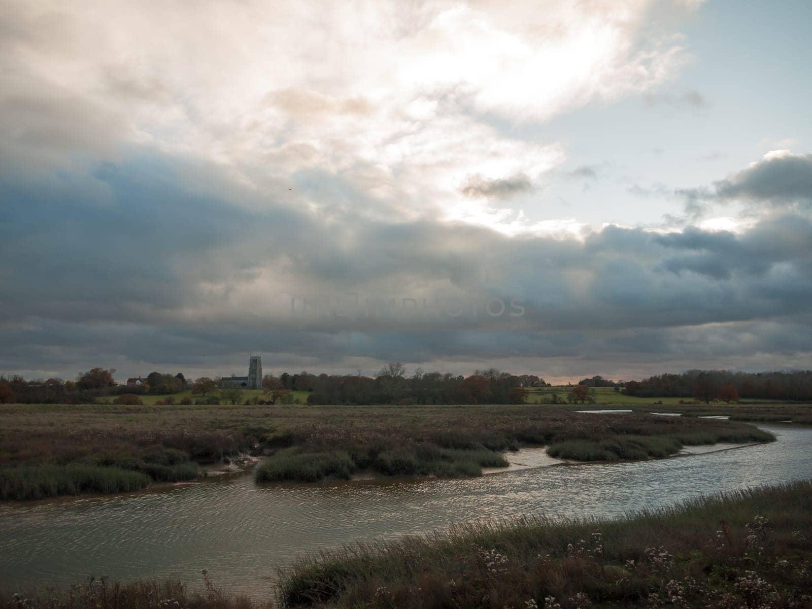 stream estuary running through countryside autumn Alresford Creek church  essex  england  uk